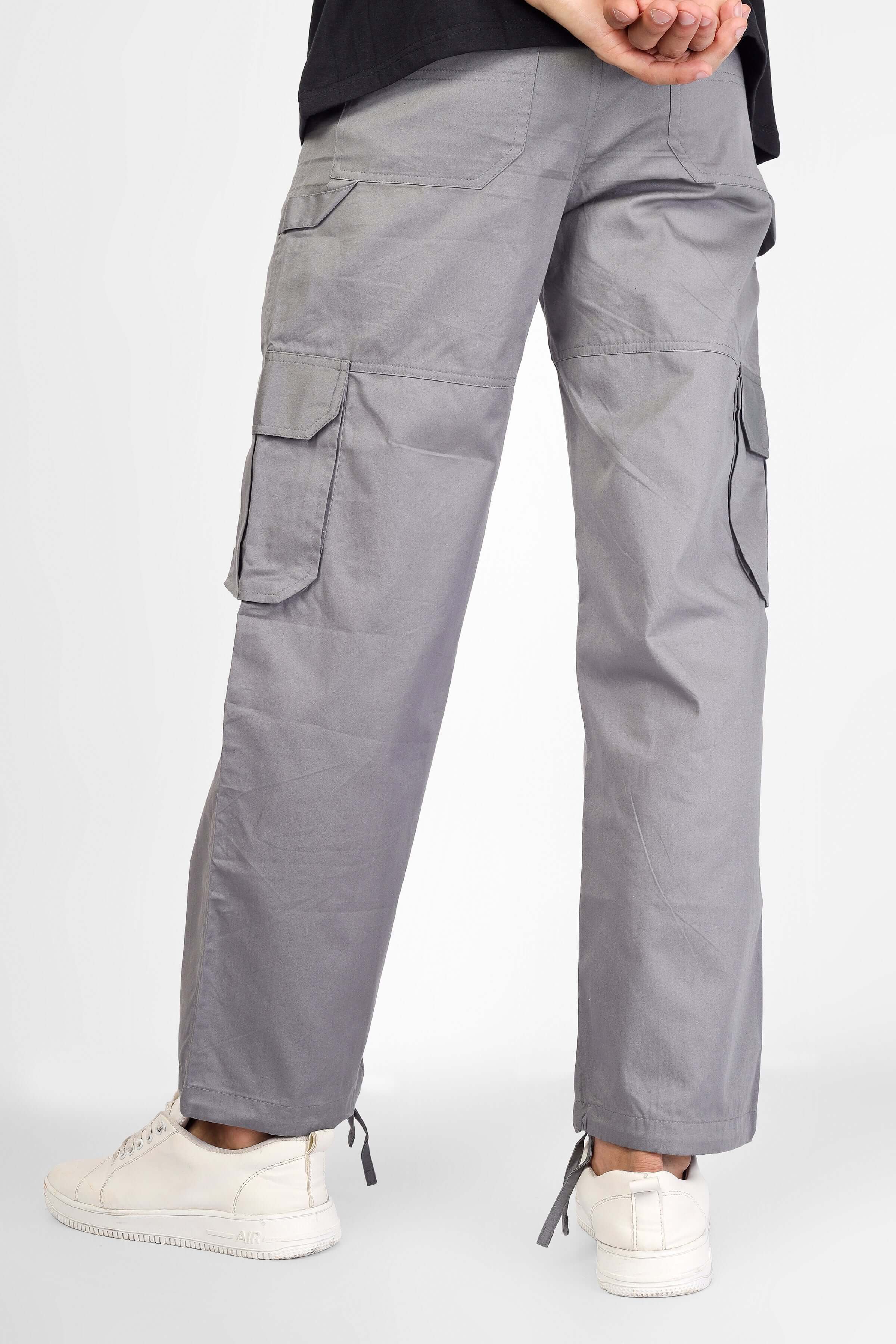 Model wearing grey Moon Stone Cargo Pants with 6 pockets, made by experienced DUDS tailors, available for custom fit orders.