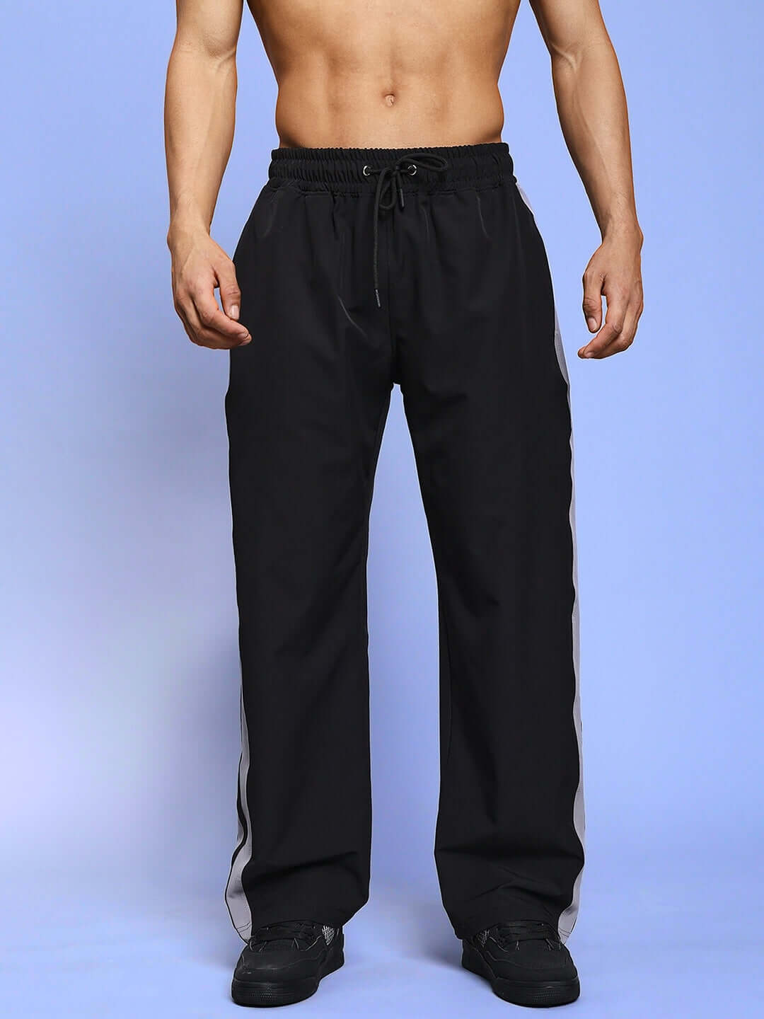 Man wearing Morgan Relaxed Fit Cargo Pants in black showcasing custom fit option.
