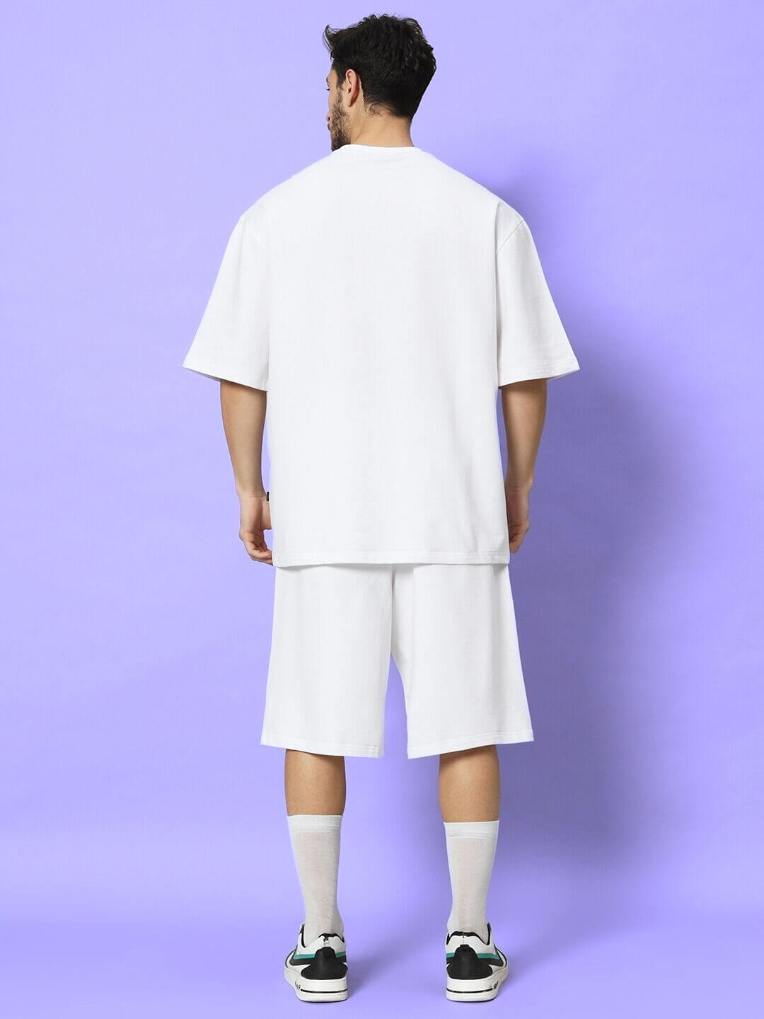 Back view of model wearing MORPH SQUAD PRINTED CO-ORD SET WHITE, a stylish street-style outfit for casualwear.