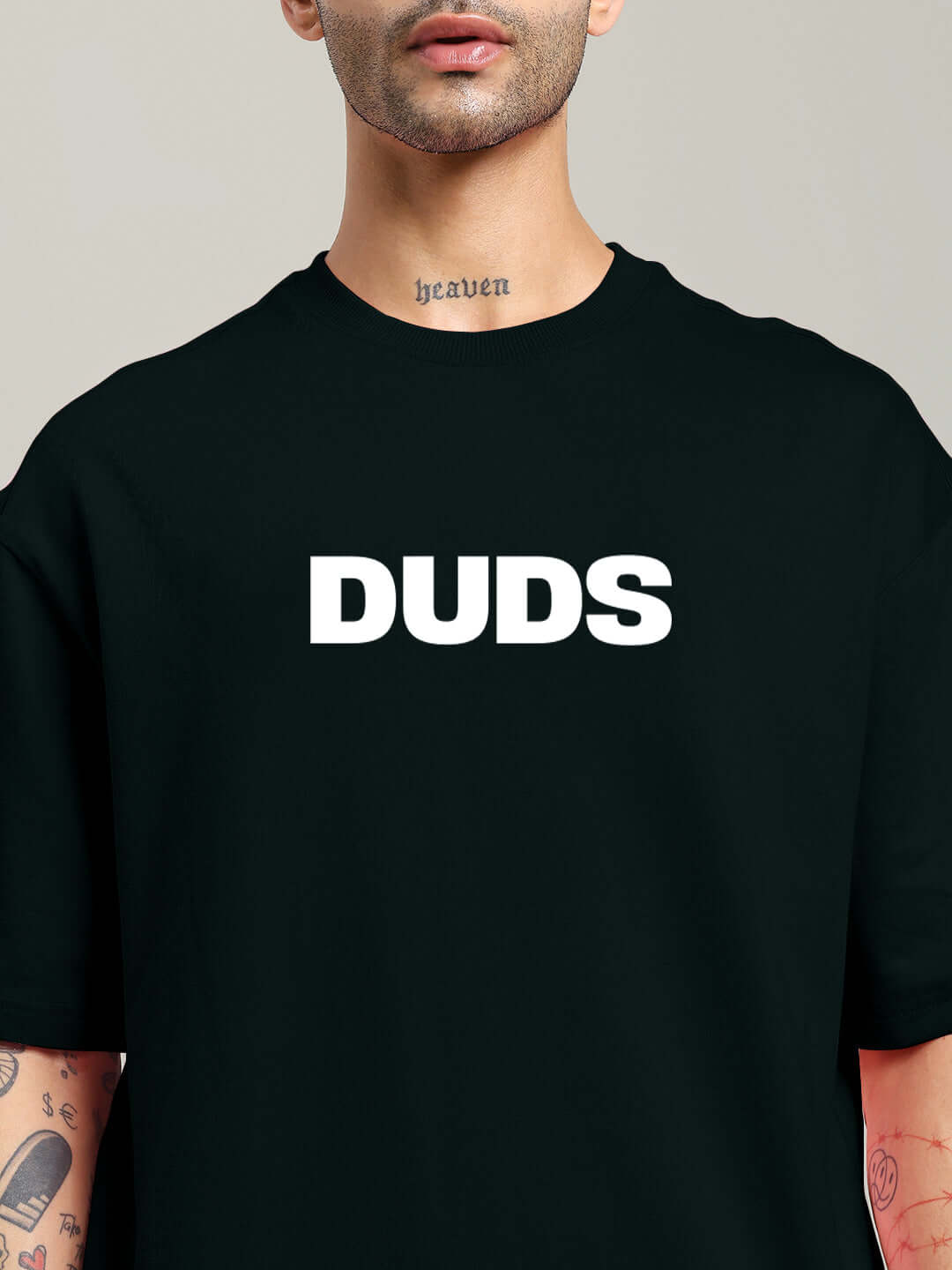 Motion Drop oversized black T-shirt made from premium cotton blend, featuring bold 'DUDS' print. Ideal for casual wear.