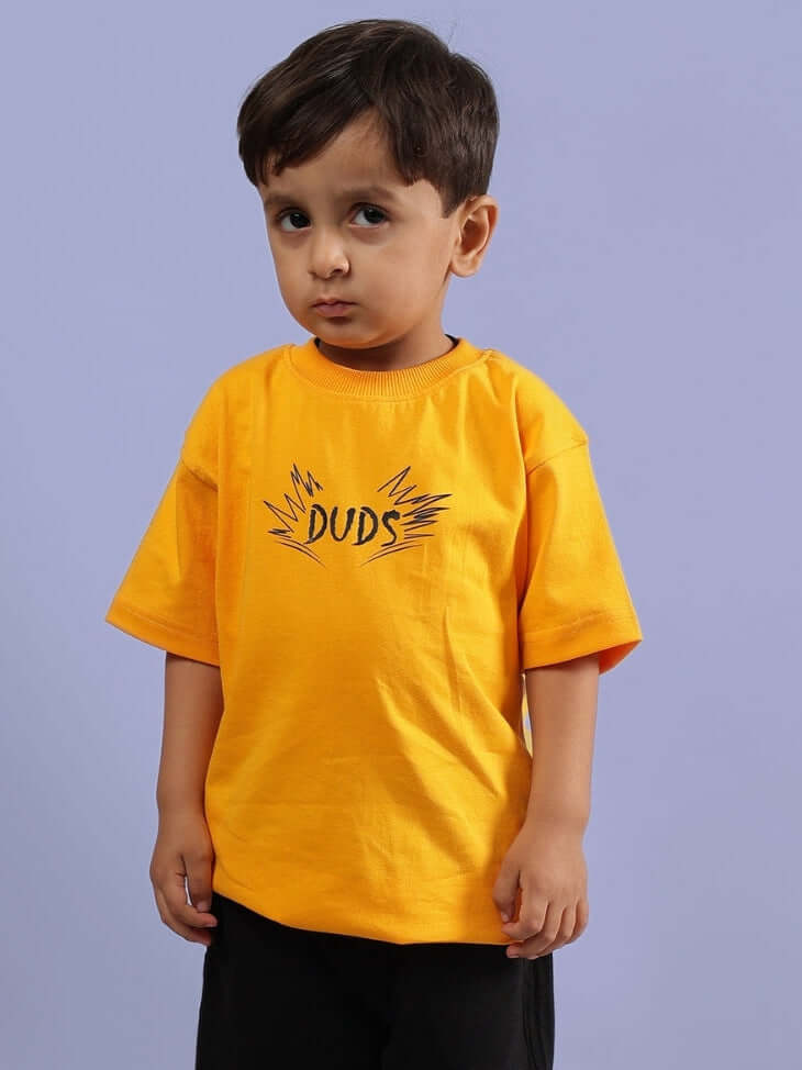 Child wearing a mustard MUFASA-DUDS t-shirt, designed for boys and girls, showcasing comfort and style.