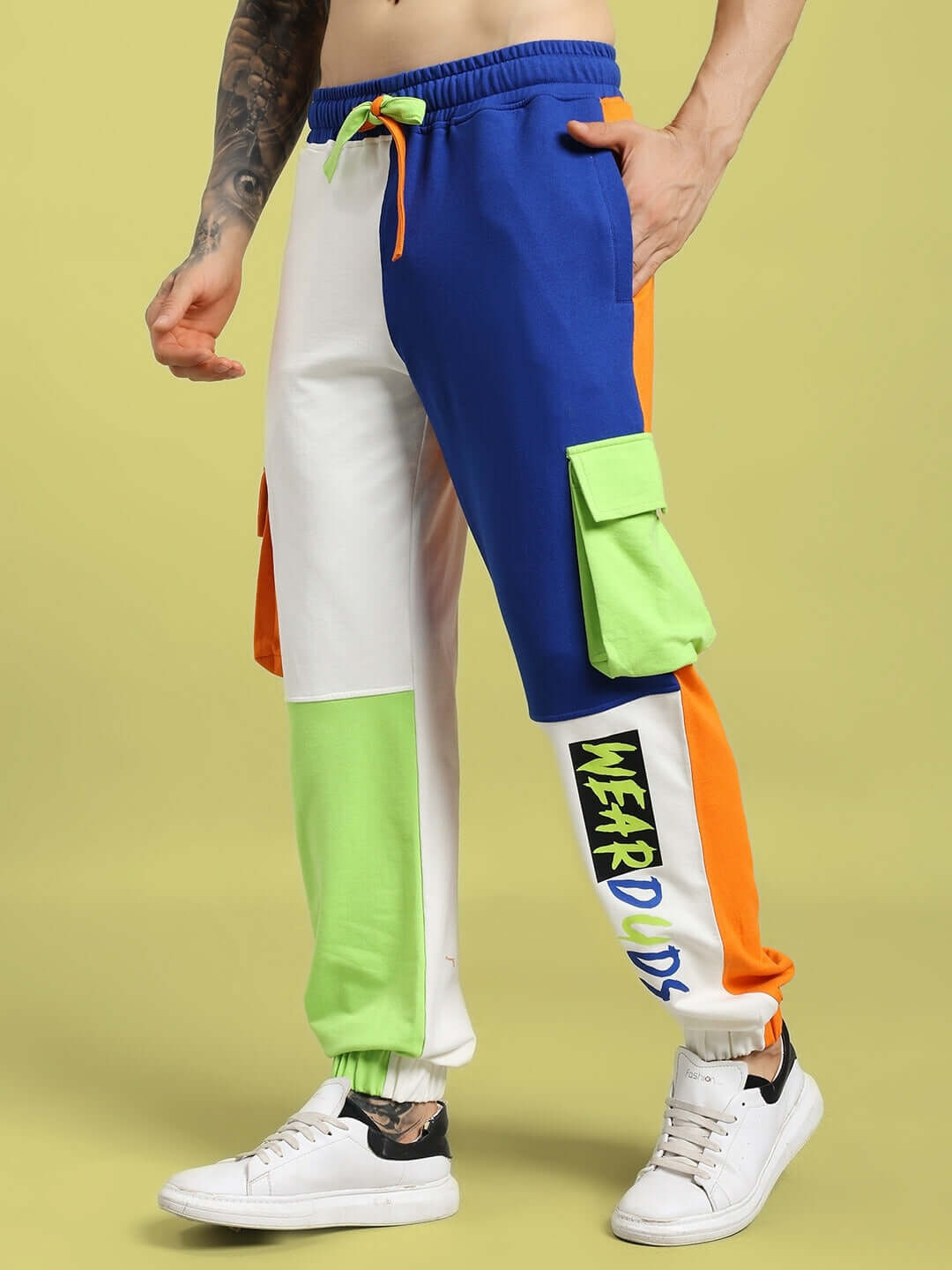 Model wearing NICE MULTI POCKET COLORBLOCK RELAXED-FIT JOGGERS MULTI with vibrant color patches showing comfort and style.