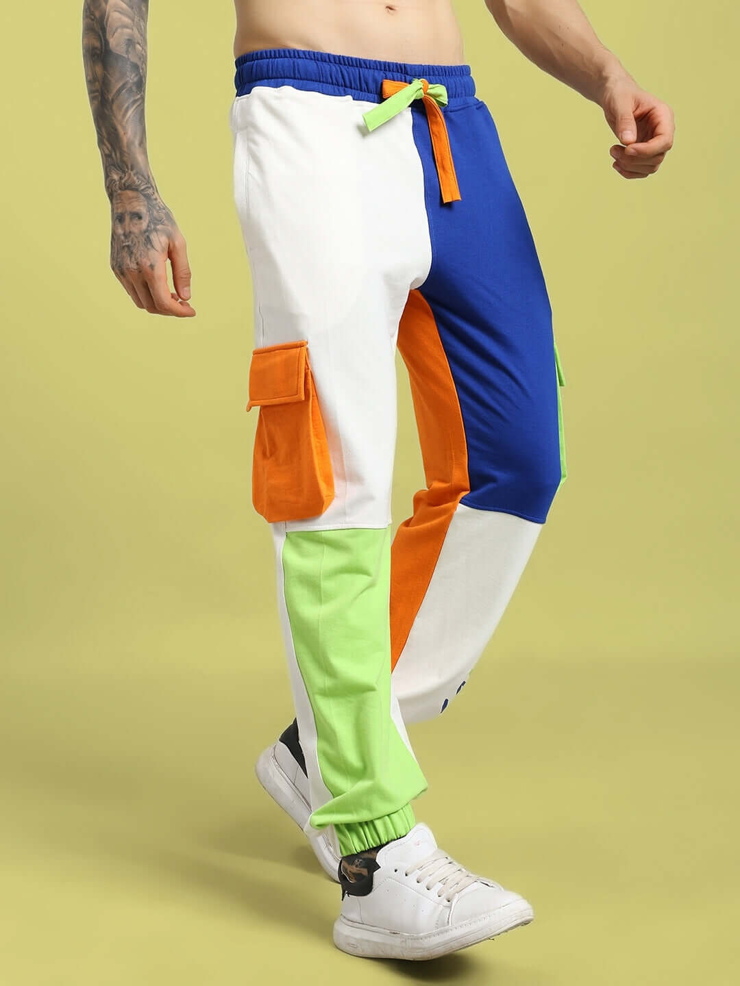 Man wearing NICE MULTI POCKET COLORBLOCK RELAXED-FIT JOGGERS MULTI, showcasing colorful design with multiple pockets for streetwear style.