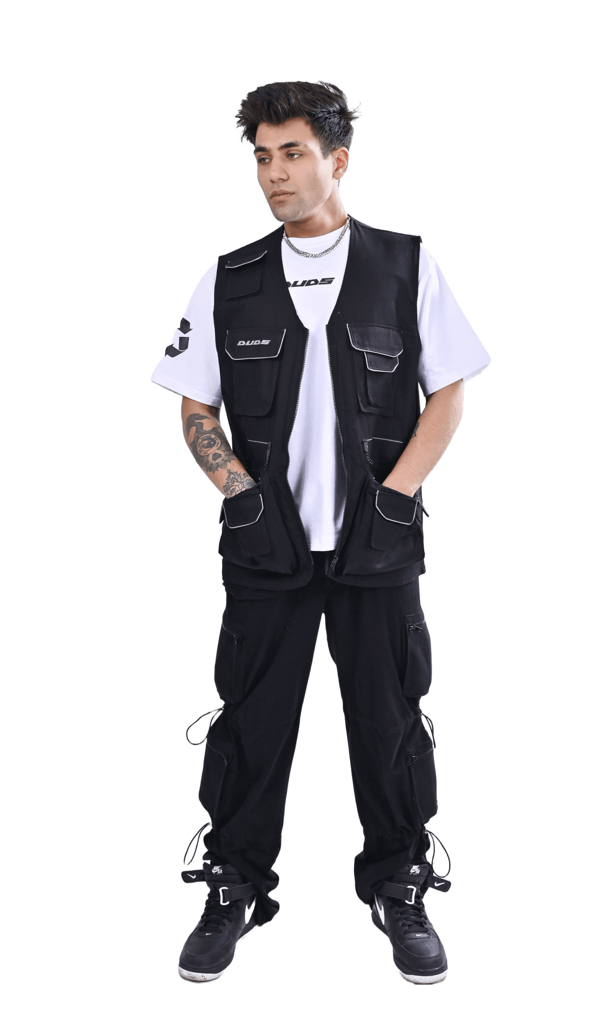 Person wearing a MULTI POCKETS REFLECTOR CARGO VEST with streetwear outfit, showcasing utility and style in urban fashion.