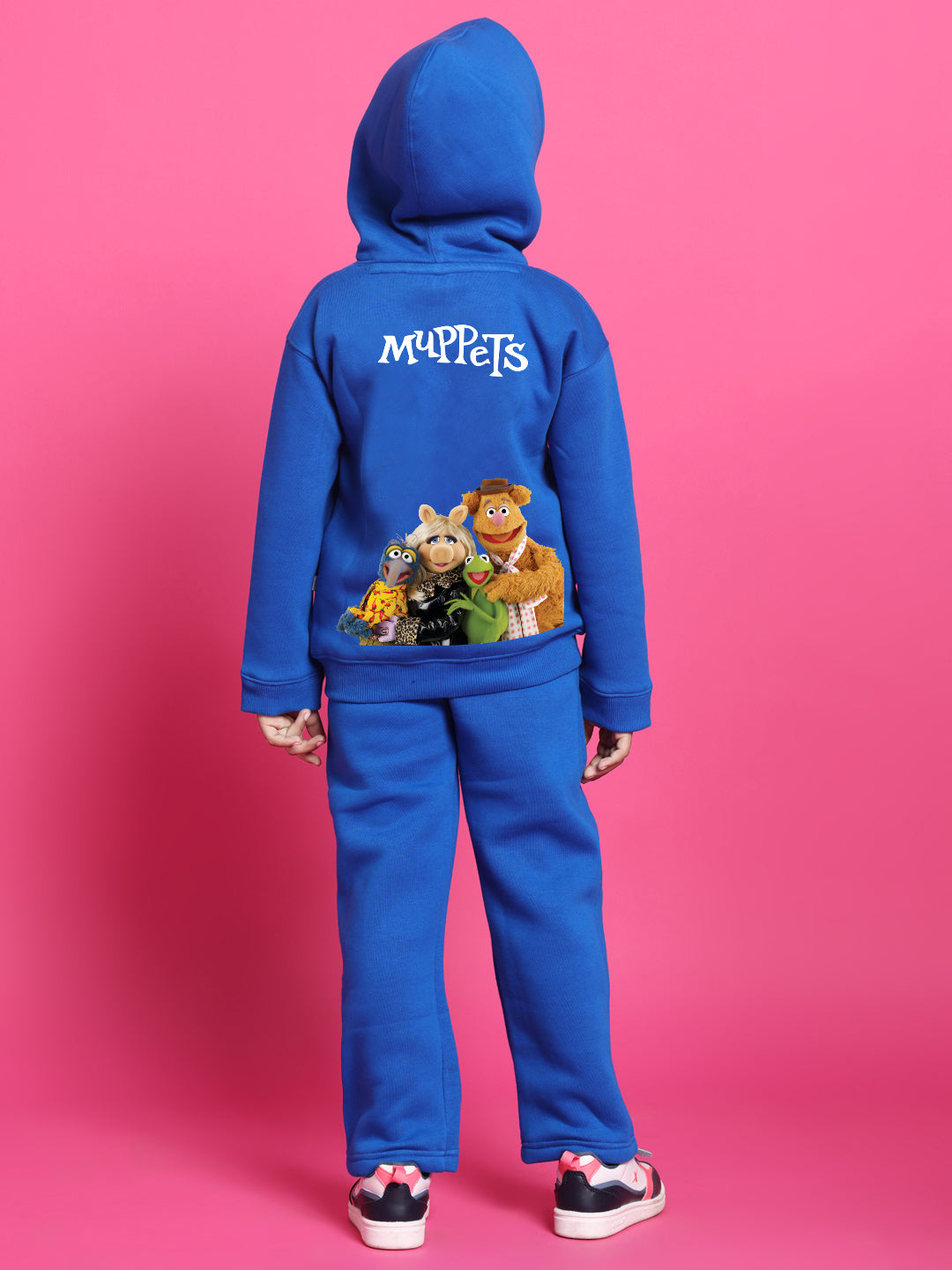 Child wearing MUPPETS FLEECE CO-ORD FOR BOYS GIRLS ROYAL BLUE with character prints on back.