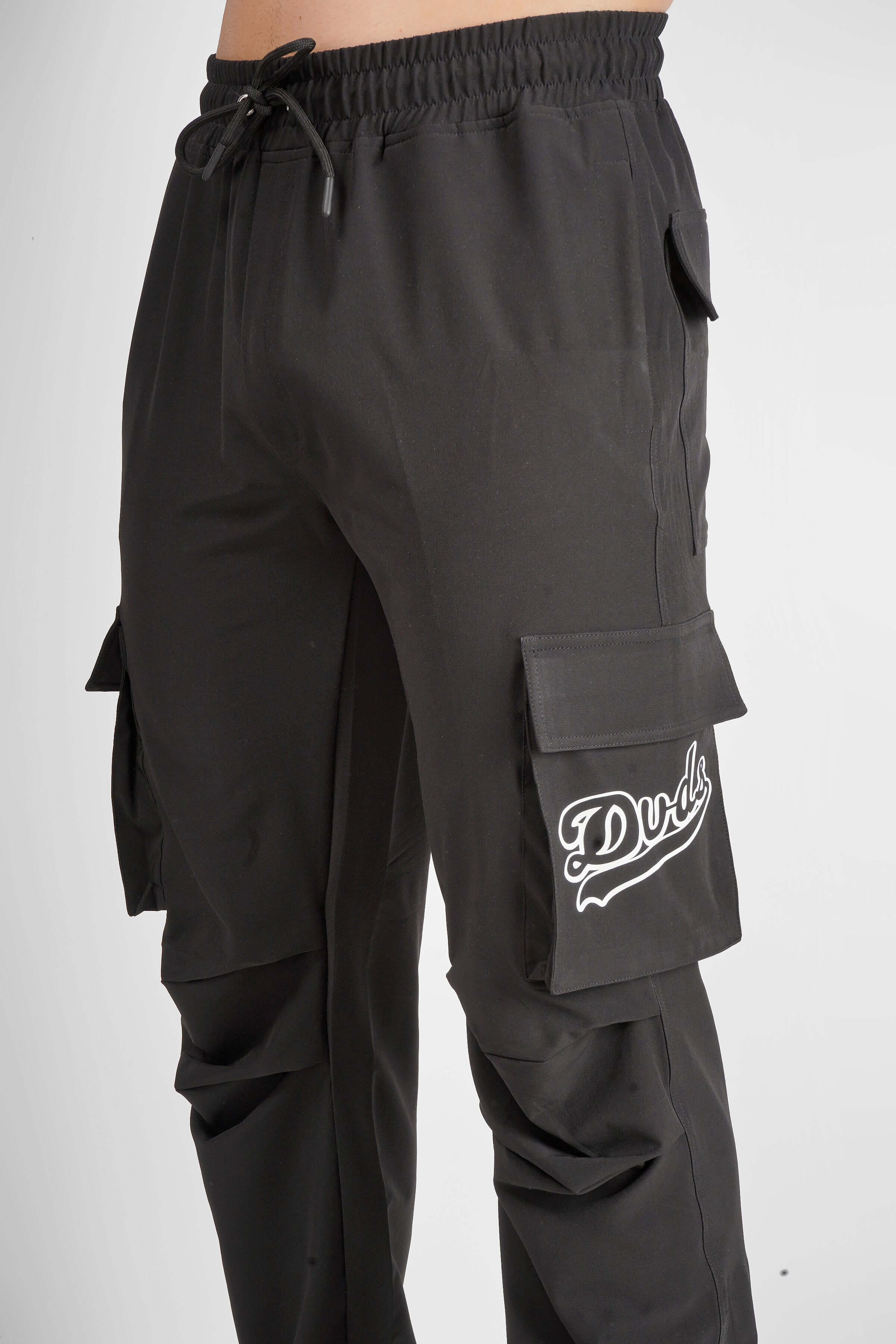 MYRIAD Relaxed Fit Cargo Pants in Dark Grey with Custom Fit option available, featuring multiple pockets and a comfortable design.