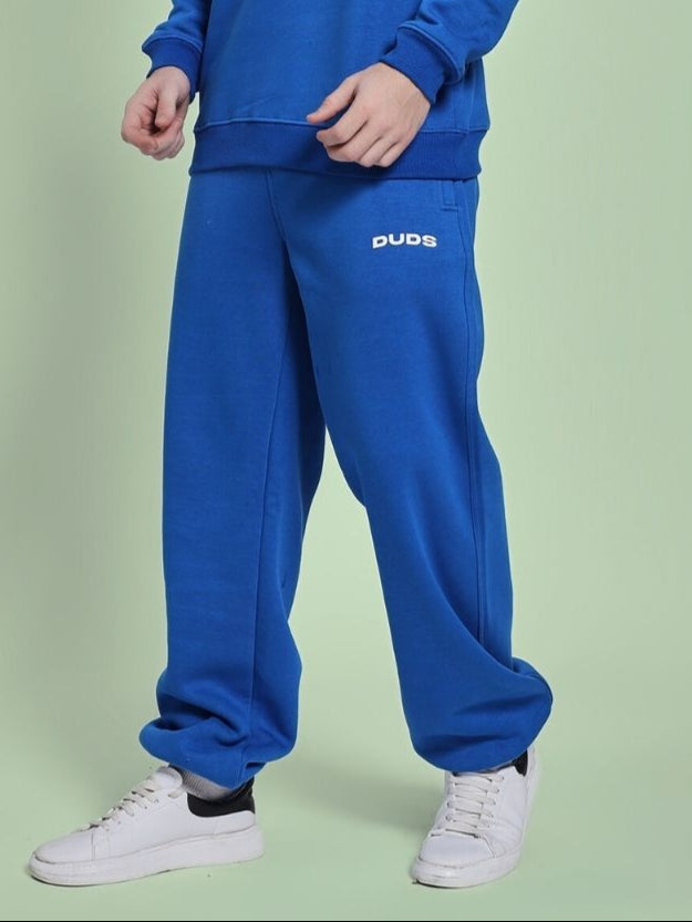 Model wearing NATURE LINK FLEECE JOGGER ROYAL BLUE, showcasing comfortable and stylish loungewear for any casual outing or relaxing at home.