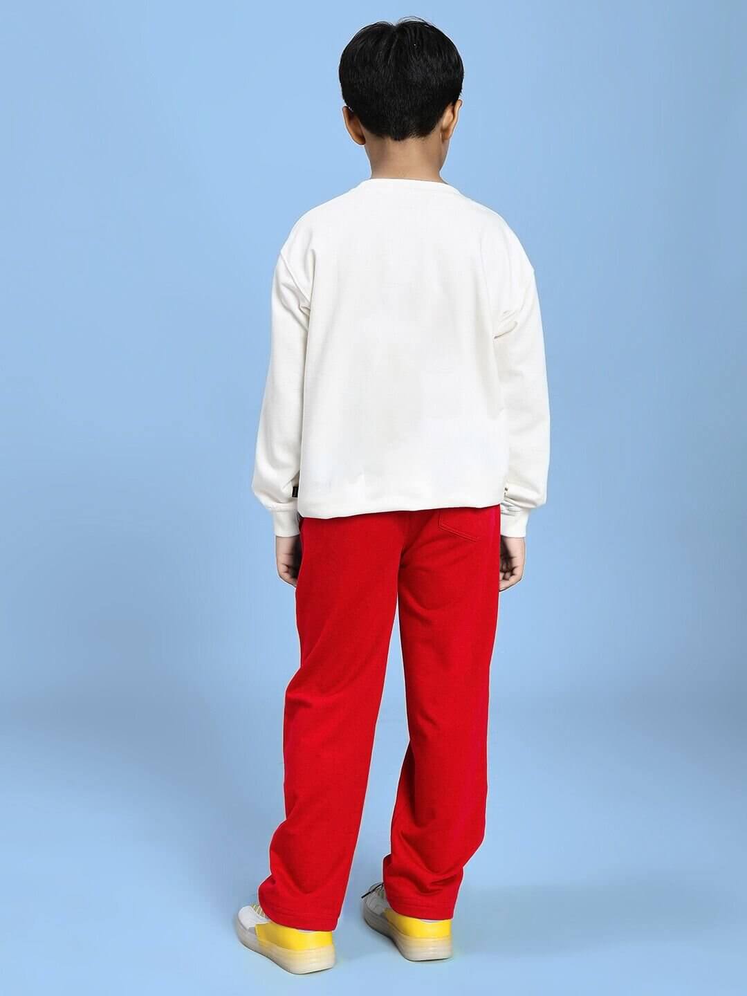 Child wearing NATURE VIBES BIRD PRINT CO-ORD FOR BOYS AND GIRLS WHITE RED outfit, shown from the back on a blue background.