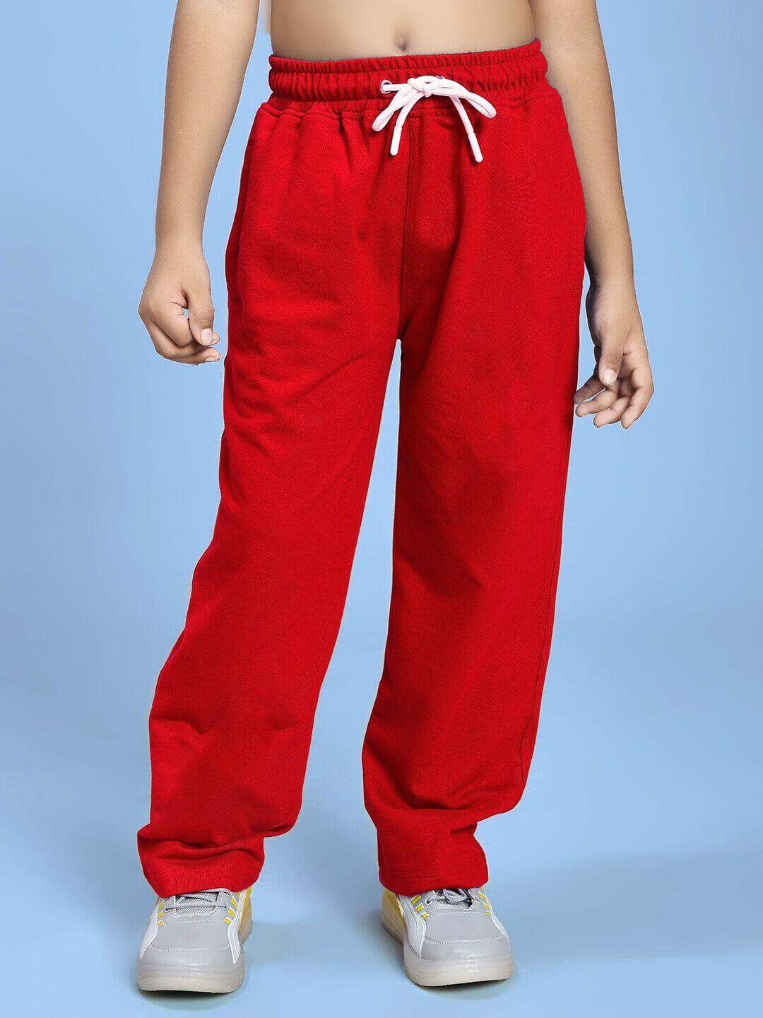Child wearing NATURE VIBES BIRD PRINT CO-ORD FOR BOYS AND GIRLS WHITE RED trousers.
