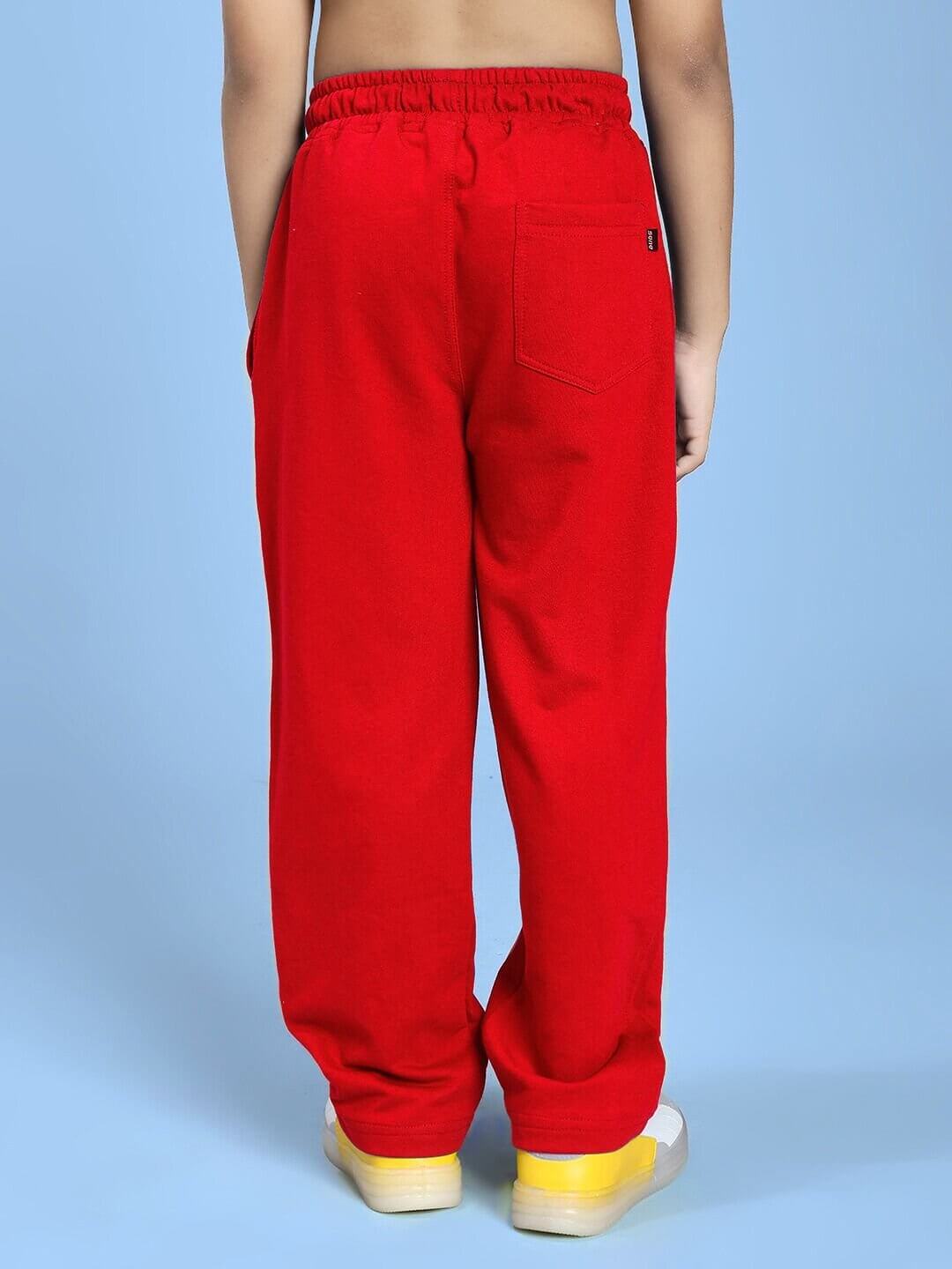 Child wearing NATURE VIBES RELAXED FIT JOGGER FOR BOYS AND GIRLS RED with elastic waistband and rear pocket detail.