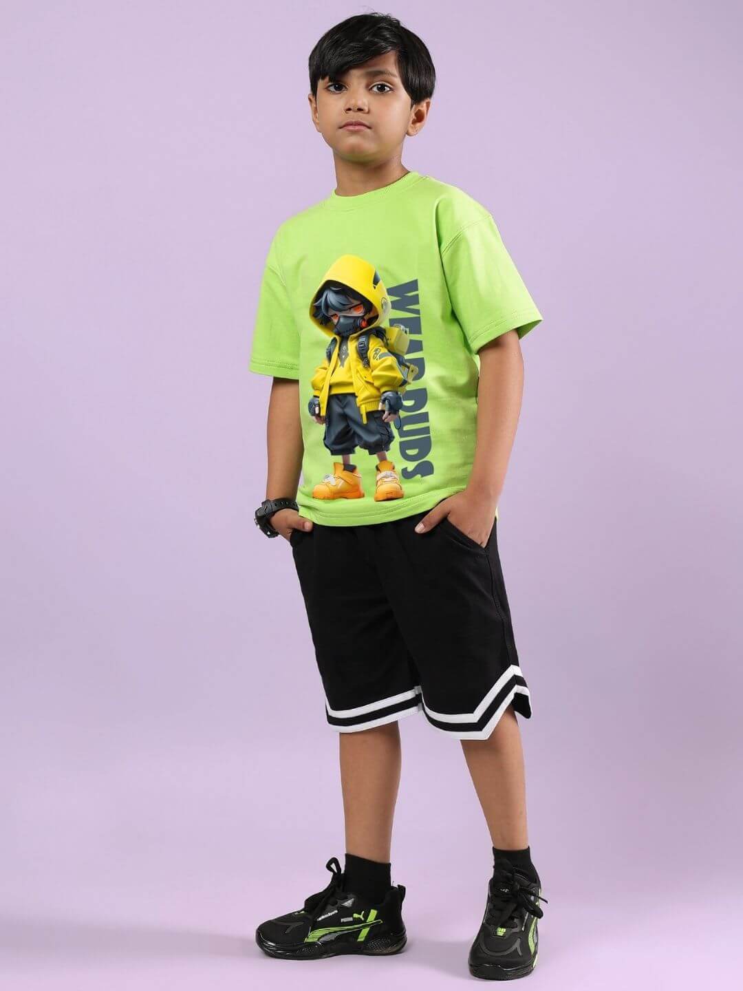 Child wearing neon green Nendoroid cartoon T-shirt and black shorts co-ord set, designed for boys and girls, stylish and comfortable.
