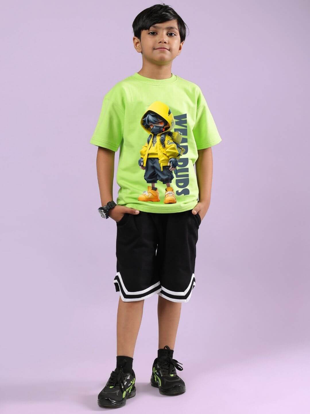 Boy wearing Nendoroid printed neon green t-shirt and black shorts set for kids streetwear fashion
