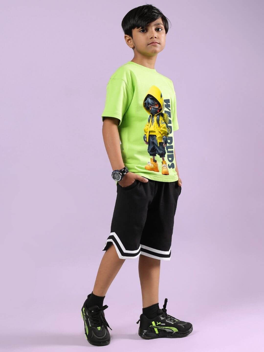 Boy wearing Nendoroid Printed Co-Ord Set in neon green T-shirt with Nendoroid cartoon print and black shorts, showcasing kids streetwear fashion.