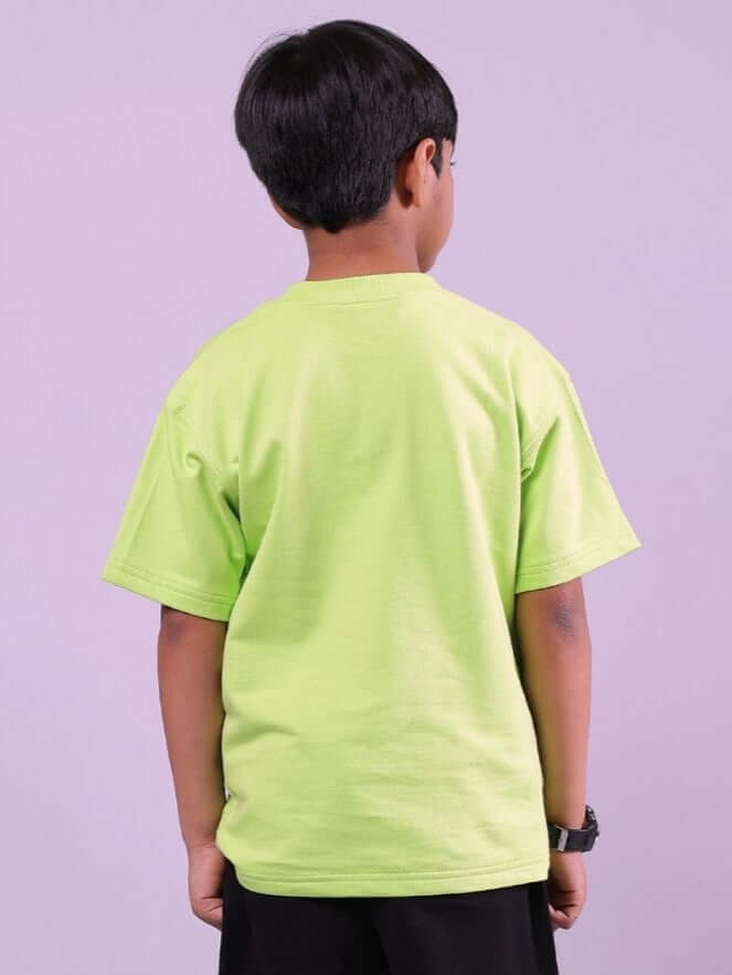 Child wearing NENDOROID PRINTED T-SHIRT FOR BOYS AND GIRLS NEON GREEN showcasing back design.