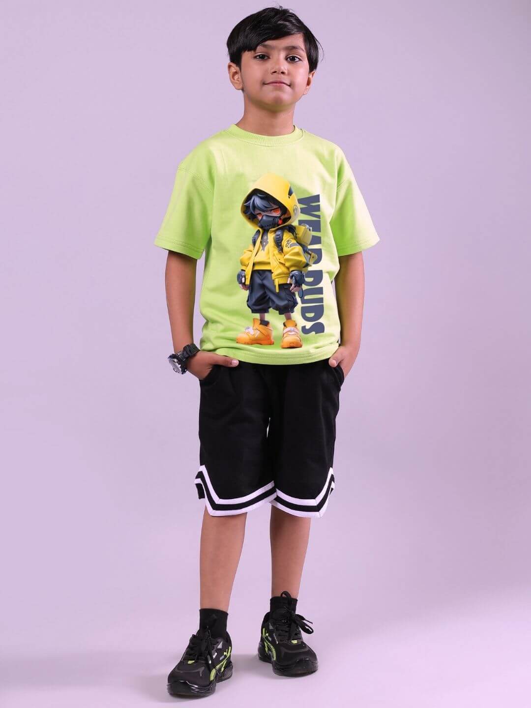 Boy wearing NENDOROID PRINTED T-SHIRT FOR BOYS AND GIRLS NEON GREEN with cartoon design, standing confidently.