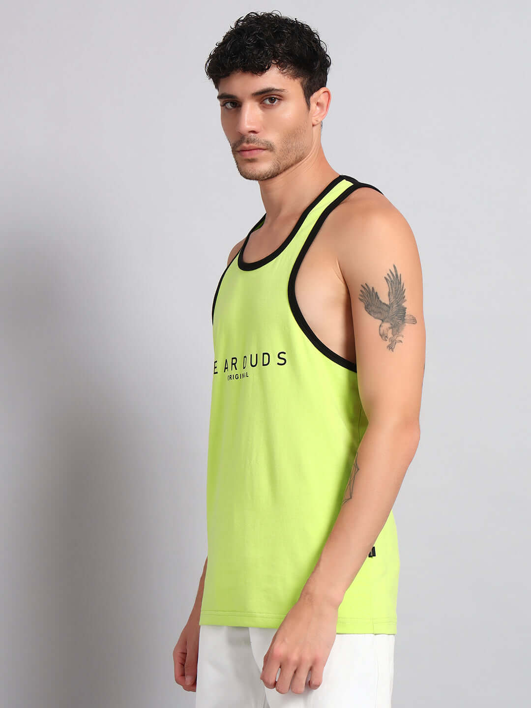 Man wearing NEO GYM T-Shirt in neon green with black trim, athletic build showcasing custom fit options for an active lifestyle.