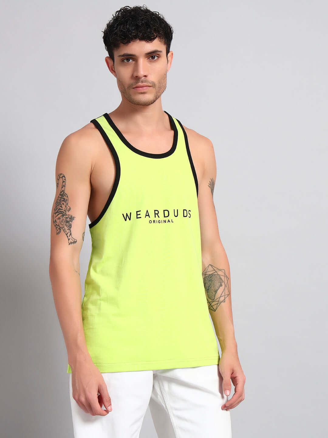 Man wearing NEO Gym T-Shirt in neon green, customizable for a perfect fit, perfect for workouts and casual wear by WEARDUDS.
