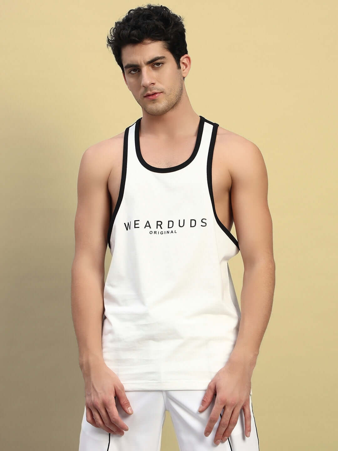 Model wearing Neo Gym T-Shirt in off-white, featuring black accents, by WEARDUDS. Custom fit available. Ideal for gym and casual wear.