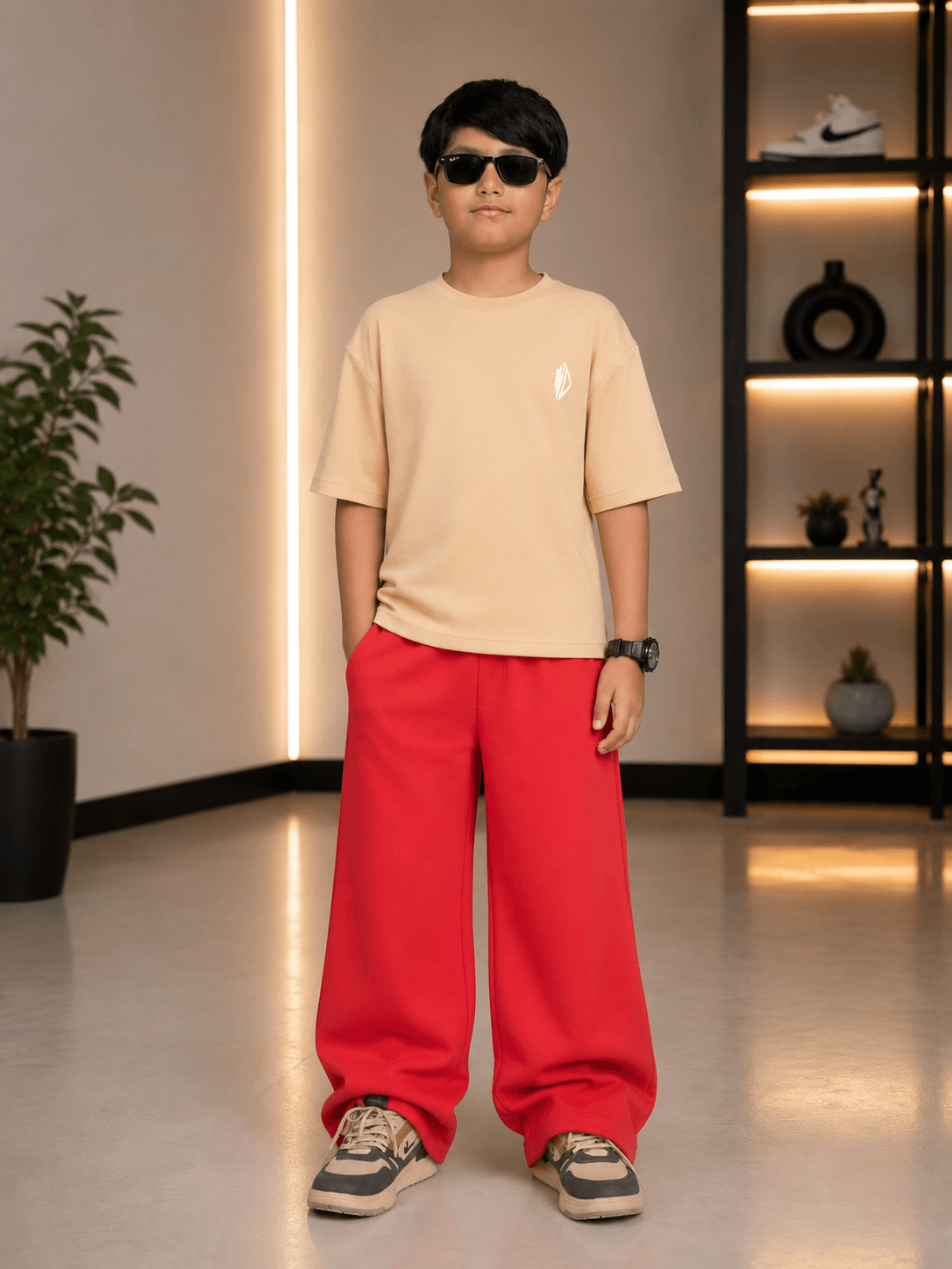 NEO STREET DROP CO-ORD FOR BOYS GIRLS BEIGE RED model wearing beige top and red pants, showcasing trendy streetwear.