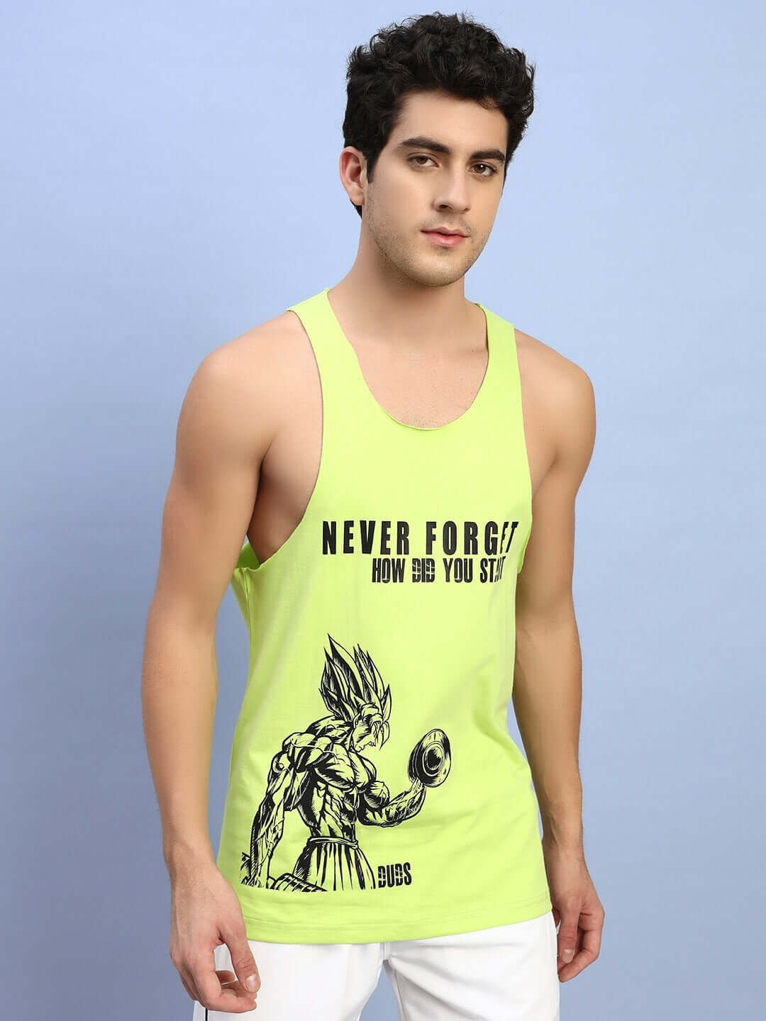 Man wearing neon green 'Never Forget' gym t-shirt with graphic design from DUDS, available in custom fit for prepaid orders.