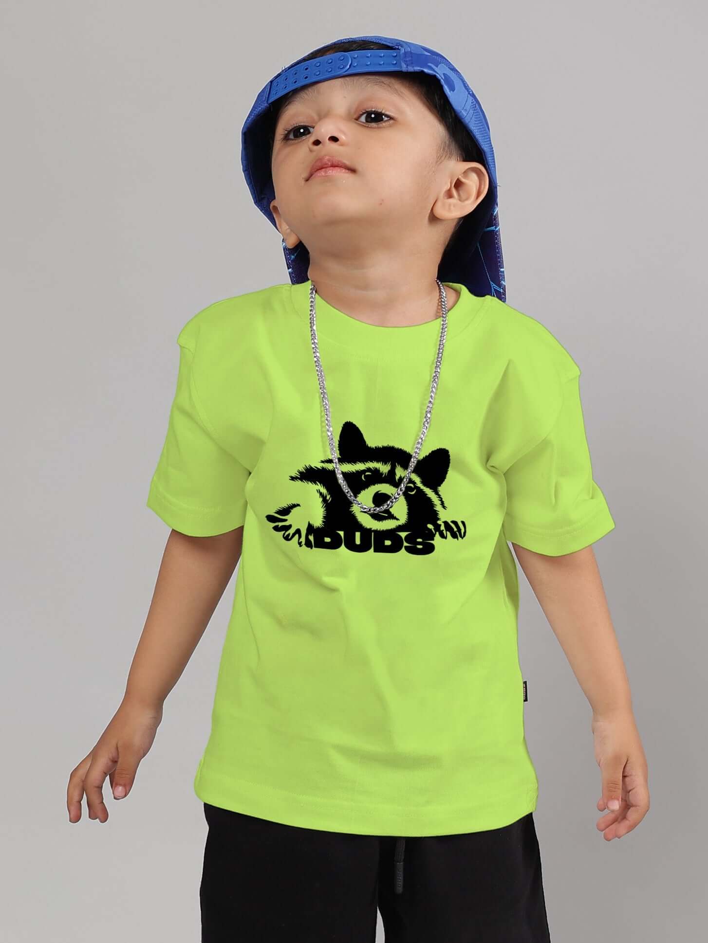 Child wearing neon green raccoon t-shirt by DUDS, featuring a playful design suitable for boys and girls with a custom fit option.