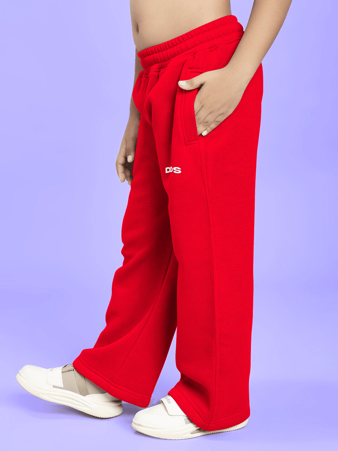 NEVER BE MY RIVAL PRINT FLEECE CO-ORD FOR BOYS GIRLS RED - close-up of children's red fleece pants on purple background.