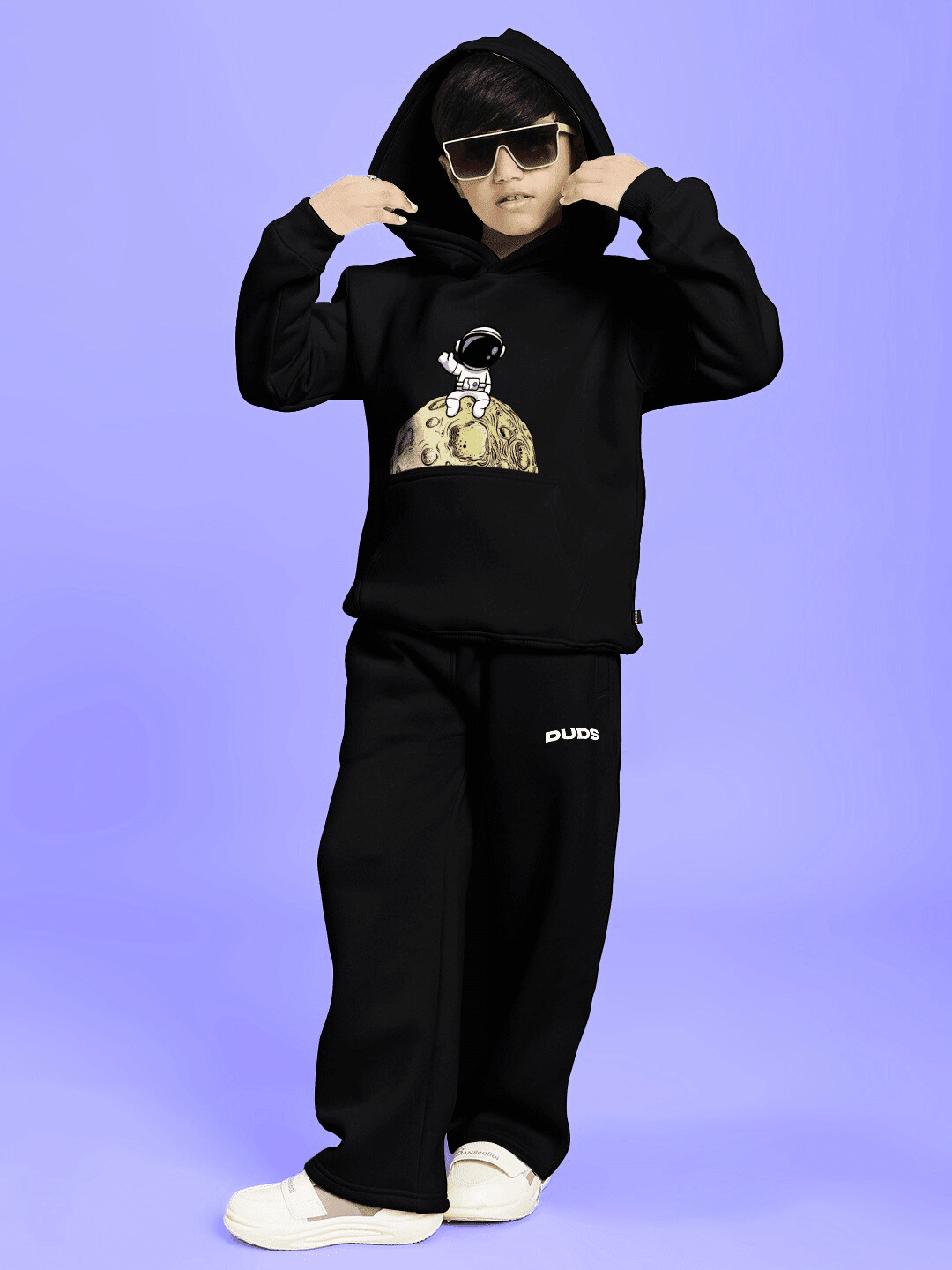 Child wearing NEXT TO A MOON FLEECE CO-ORD FOR BOYS AND GIRLS BLACK, showcasing cozy and stylish winter wear with hoodie and pants.