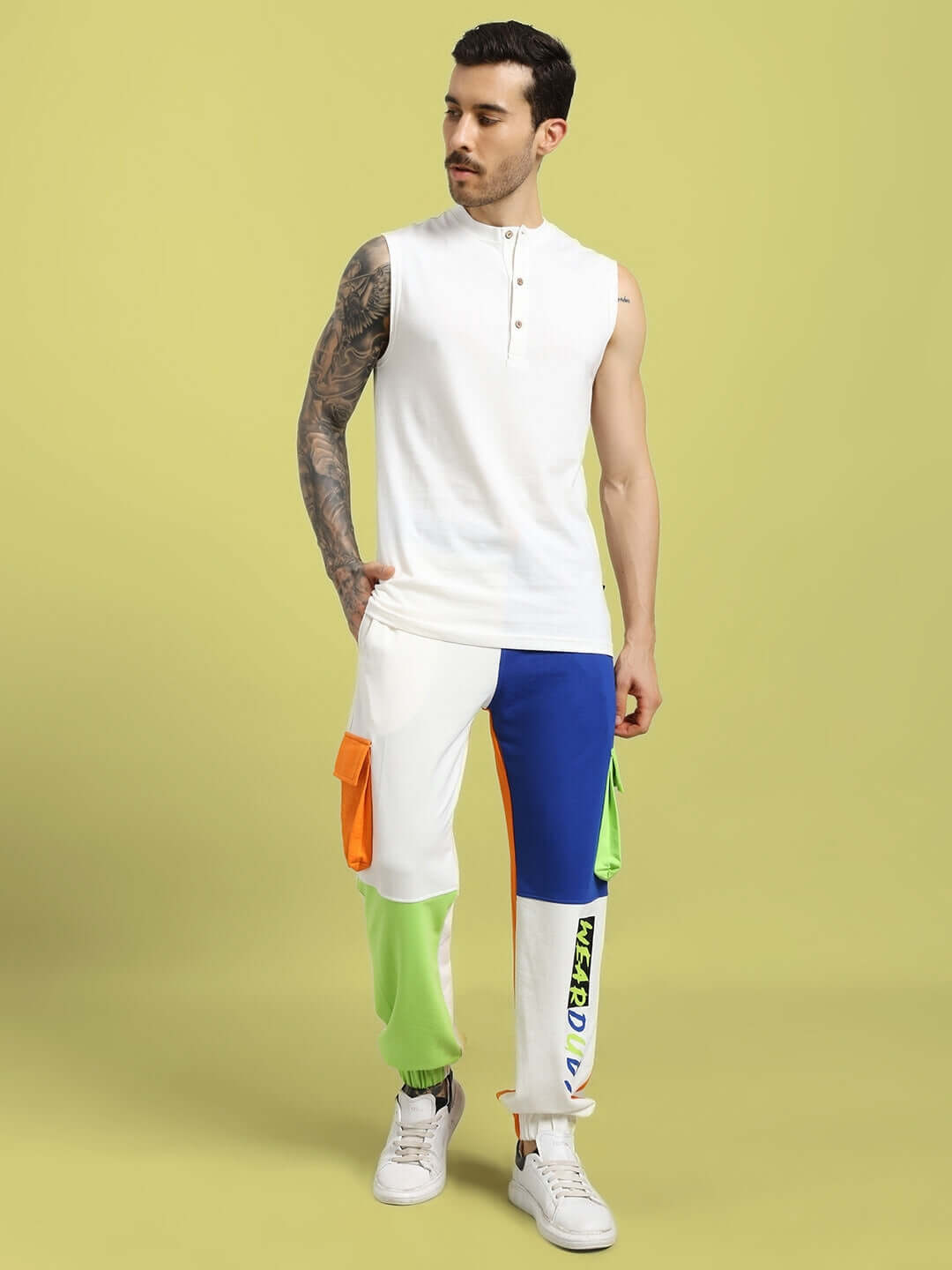 Male model wearing NICE MULTI POCKET COLORBLOCK RELAXED-FIT JOGGERS MULTI in stylish streetwear pose