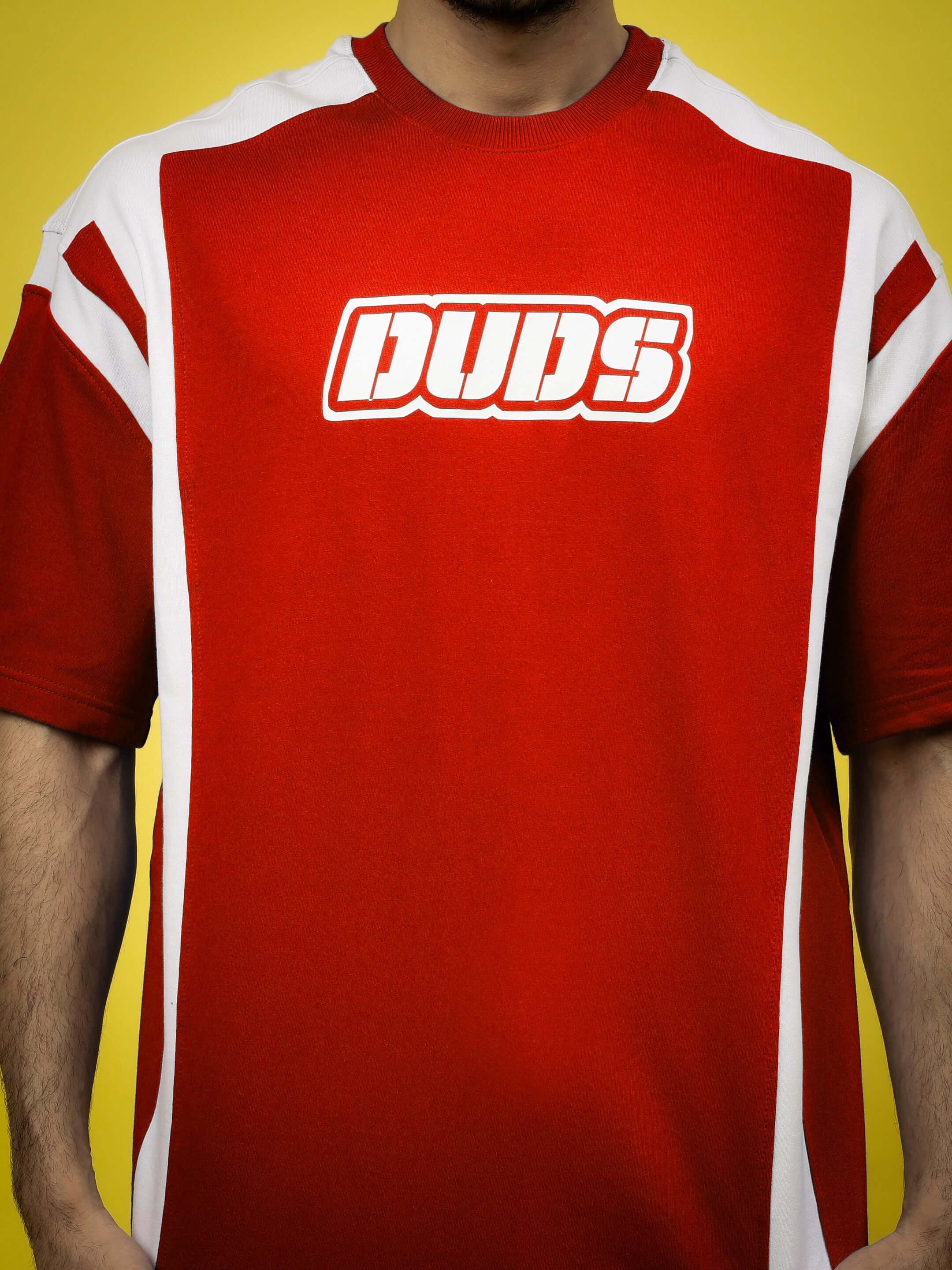 Person wearing NINJA STORM OVER-SIZED T-SHIRT RED with bold design and streetwear style.