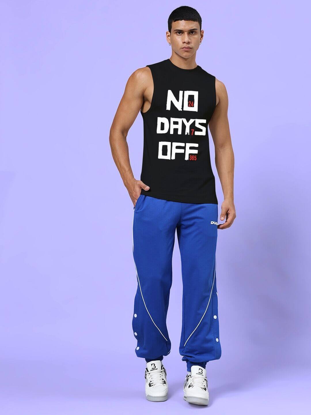 Man wearing NO DAYS OFF GYM SLEEVELESS T-SHIRT BLACK, ideal for workouts, featuring bold graphic design.
