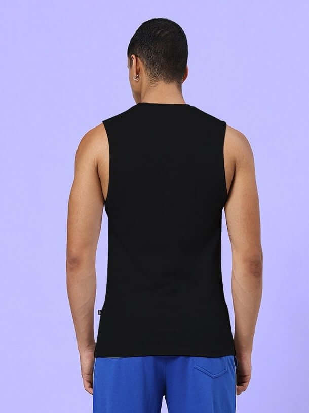 Back view of man wearing NO DAYS OFF GYM SLEEVELESS T-SHIRT BLACK, showcasing premium cotton-spandex blend for flexibility and style.