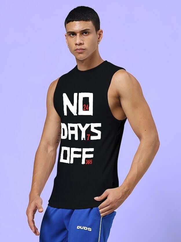 Man wearing NO DAYS OFF GYM SLEEVELESS T-SHIRT BLACK for workouts, showcasing bold graphic message on black sleeveless tee.