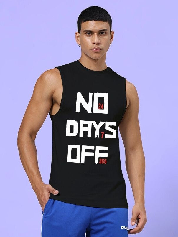 Man wearing NO DAYS OFF GYM SLEEVELESS T-SHIRT BLACK standing against light purple background.