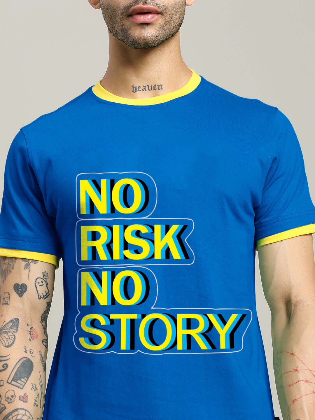 Man wearing a NO RISK PRINTED REGULAR FIT T-SHIRT ROYAL BLUE with bold text design.