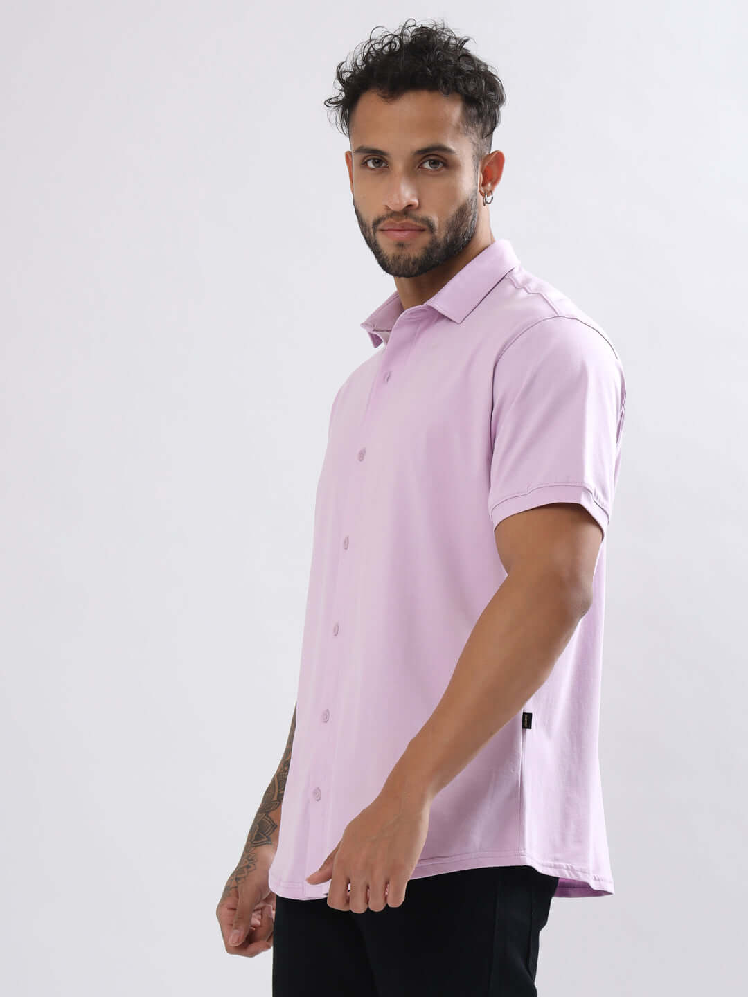 Model wearing Noir Lilac Shirt with half sleeves, curved hem, and slim fit designed for comfort. Made from 100% cotton Lycra.