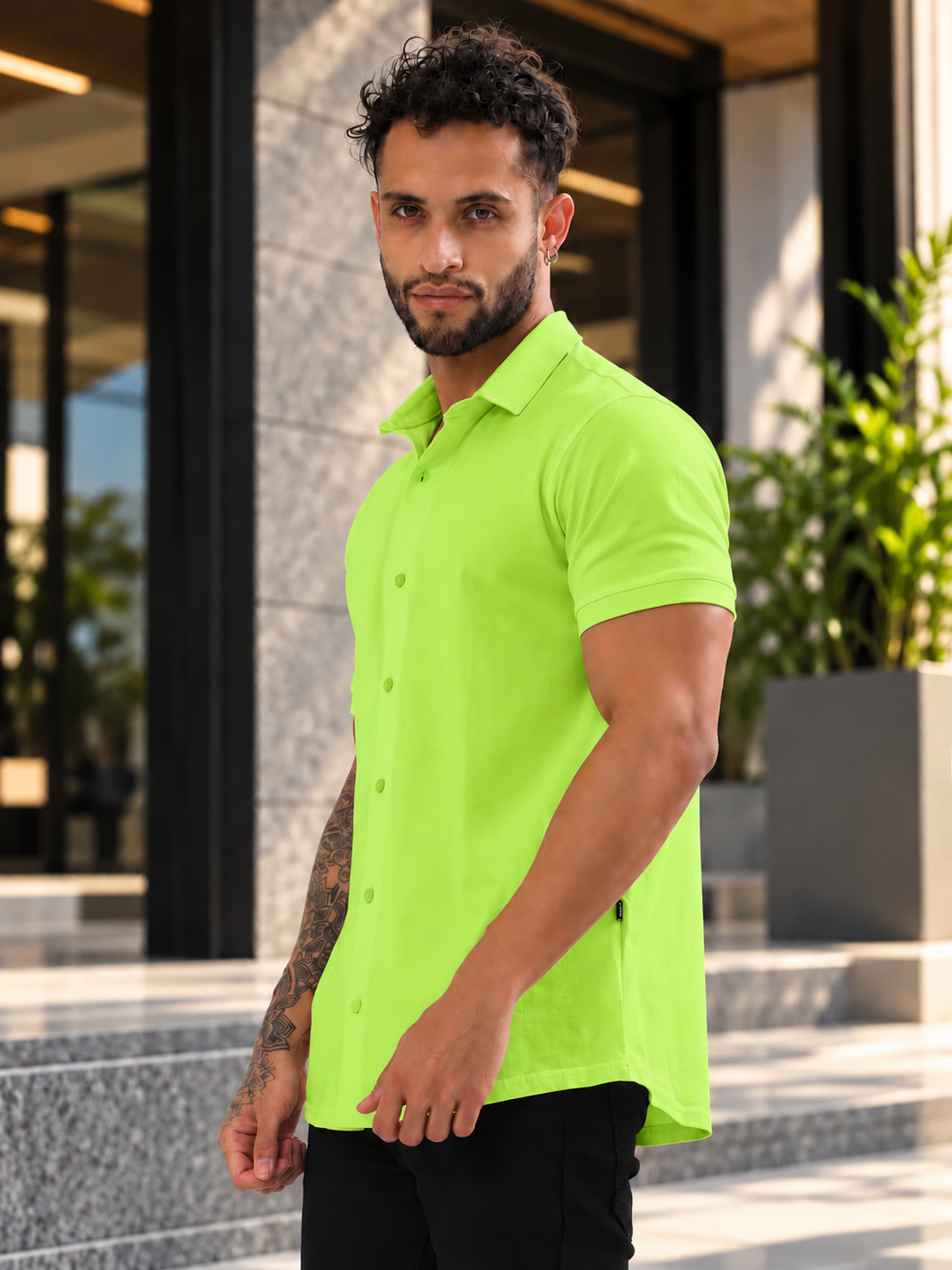 Man wearing NOIR NEON GREEN HALF-SLEEVE SHIRT SLIM FIT outdoors, showcasing a sleek, modern, and stylish casual look