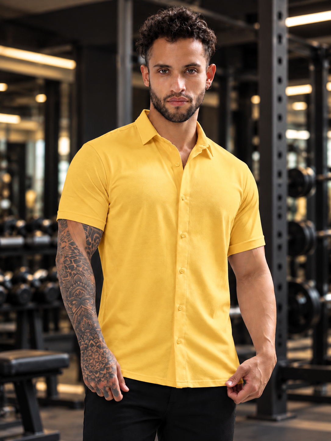 Man wearing NOIR YELLOW HALF-SLEEVE SHIRT SLIM FIT in gym setting, stylish slim fit button-up design