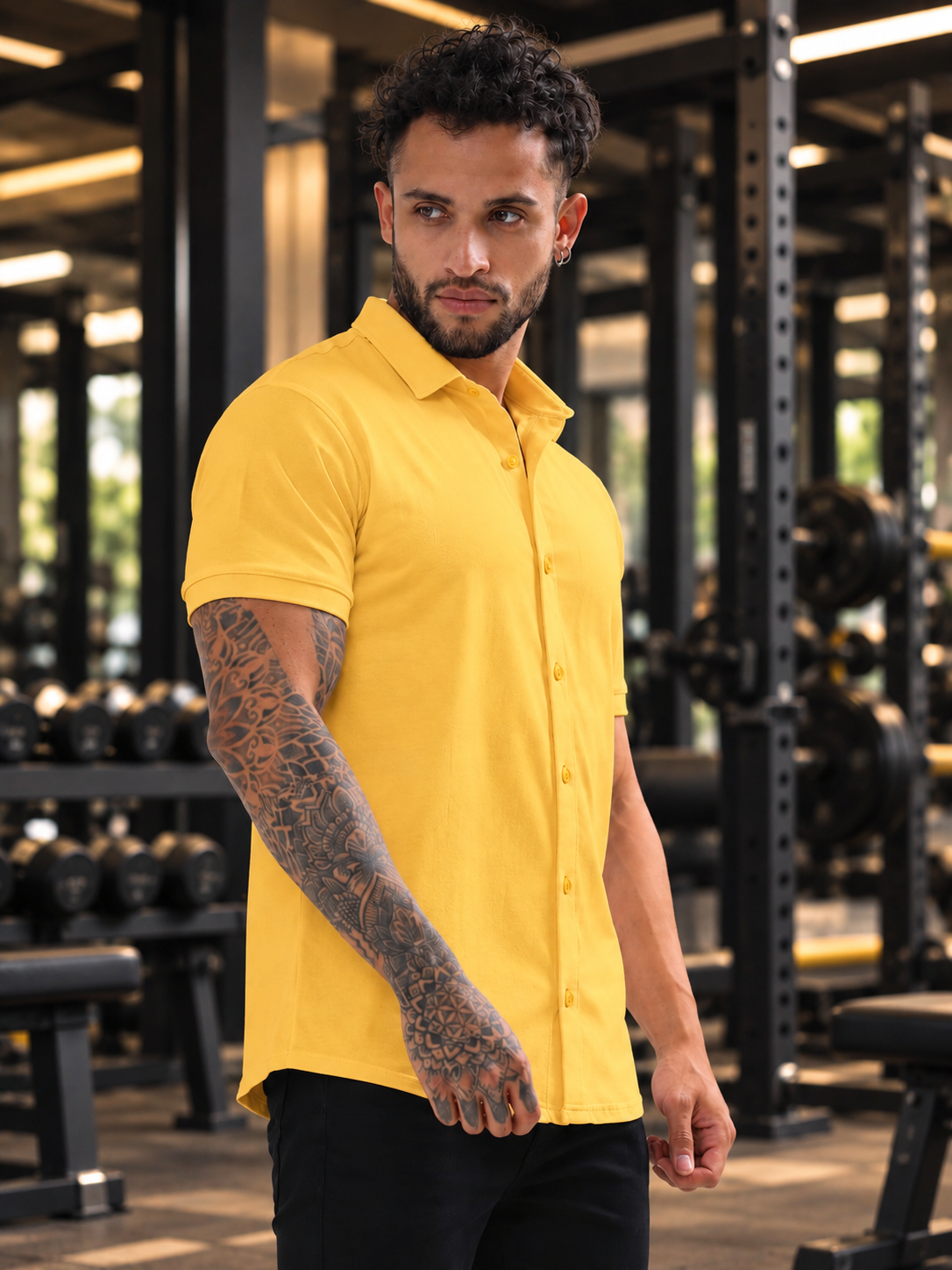 Man wearing NOIR YELLOW HALF-SLEEVE SHIRT SLIM FIT in a gym setting, showcasing stylish slim fit design