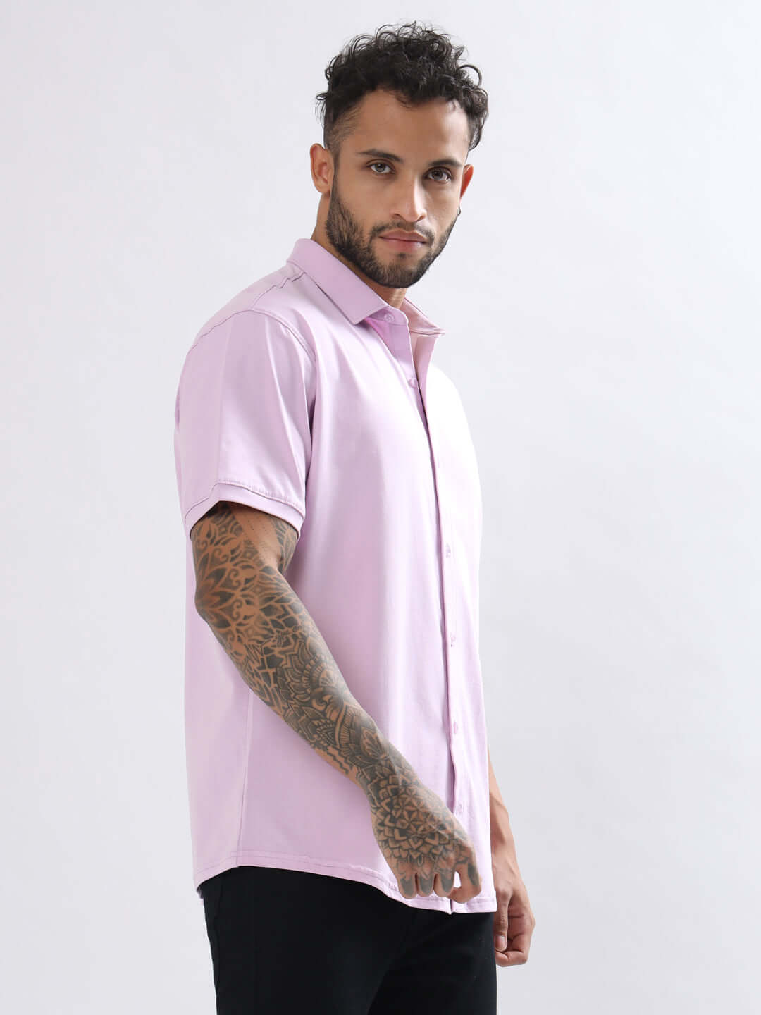 Model wearing Noir Lilac Shirt with half sleeves, showcasing wrinkle-free, 4-way stretch fabric, and slim fit design.