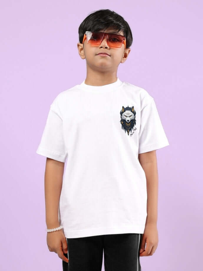 Boy wearing NORDIC WOLF OVERSIZED T-SHIRT FOR BOYS & GIRLS WHITE with wolf graphic on purple background.