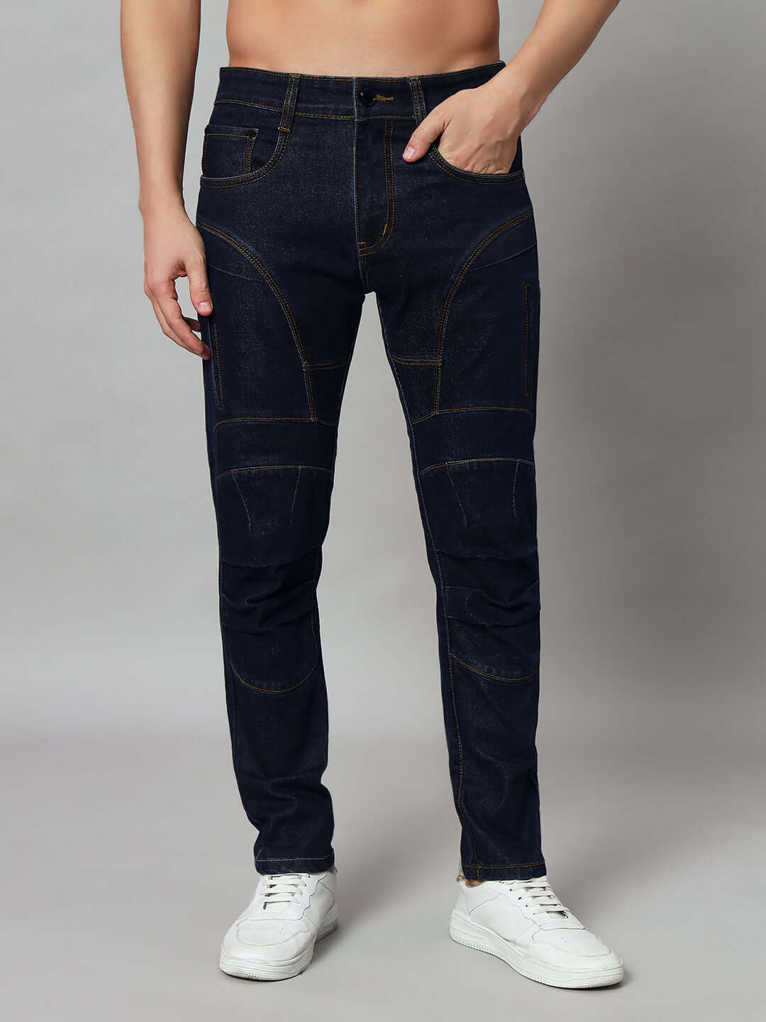 Man wearing blue contrast stitch denim jeans from DUDS, available for custom fit orders.