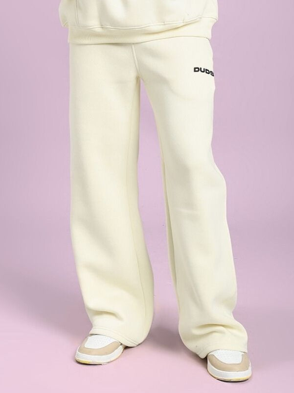 OCEAN BUDDIES JOGGER OFF-WHITE pants featuring playful sea life graphics, perfect for casual outings or lounging in comfort and style.