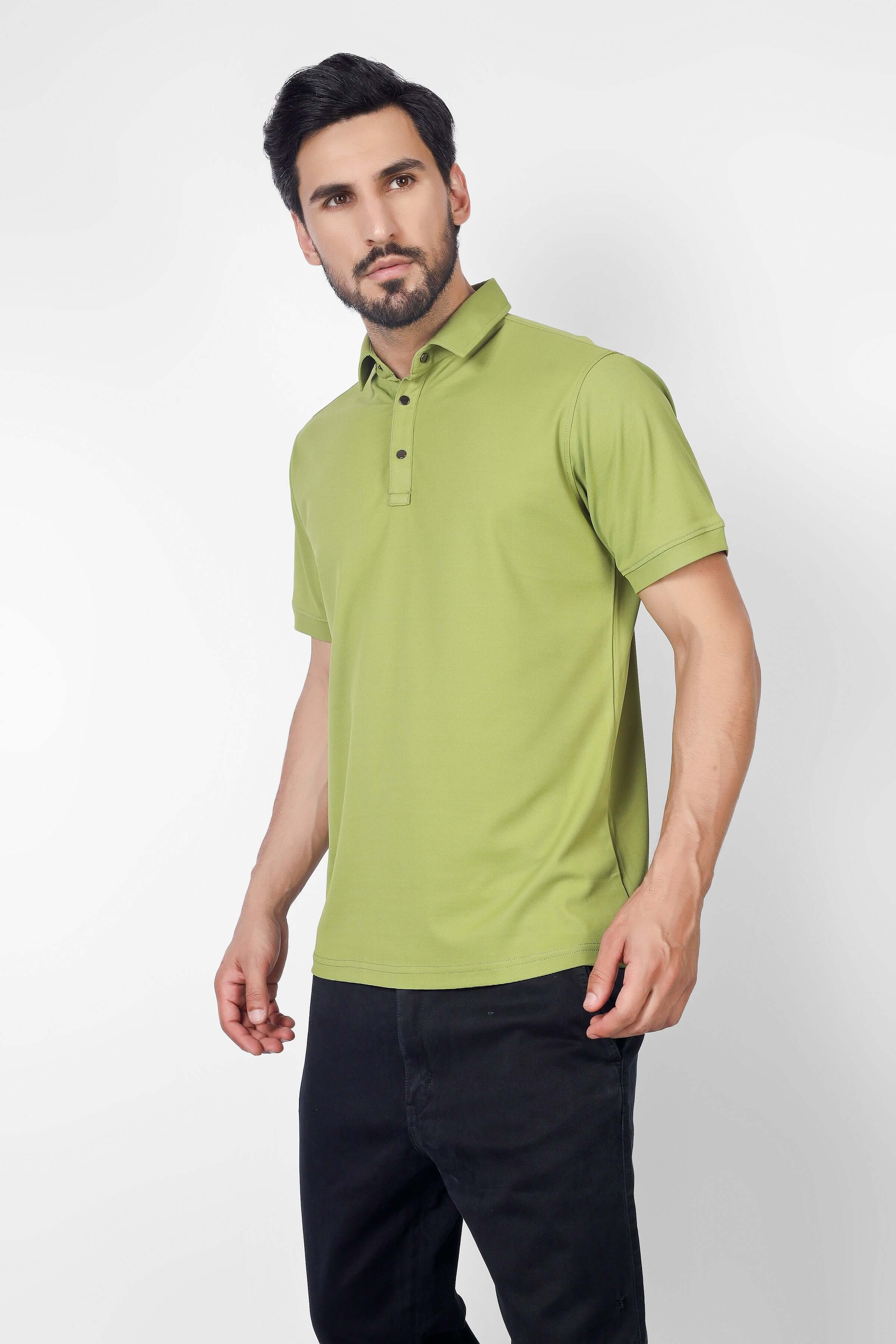 Model wearing olive green polo neck t-shirt, half sleeves, 4-way stretch, wrinkle-free, made of 100% polyester, metal button front.