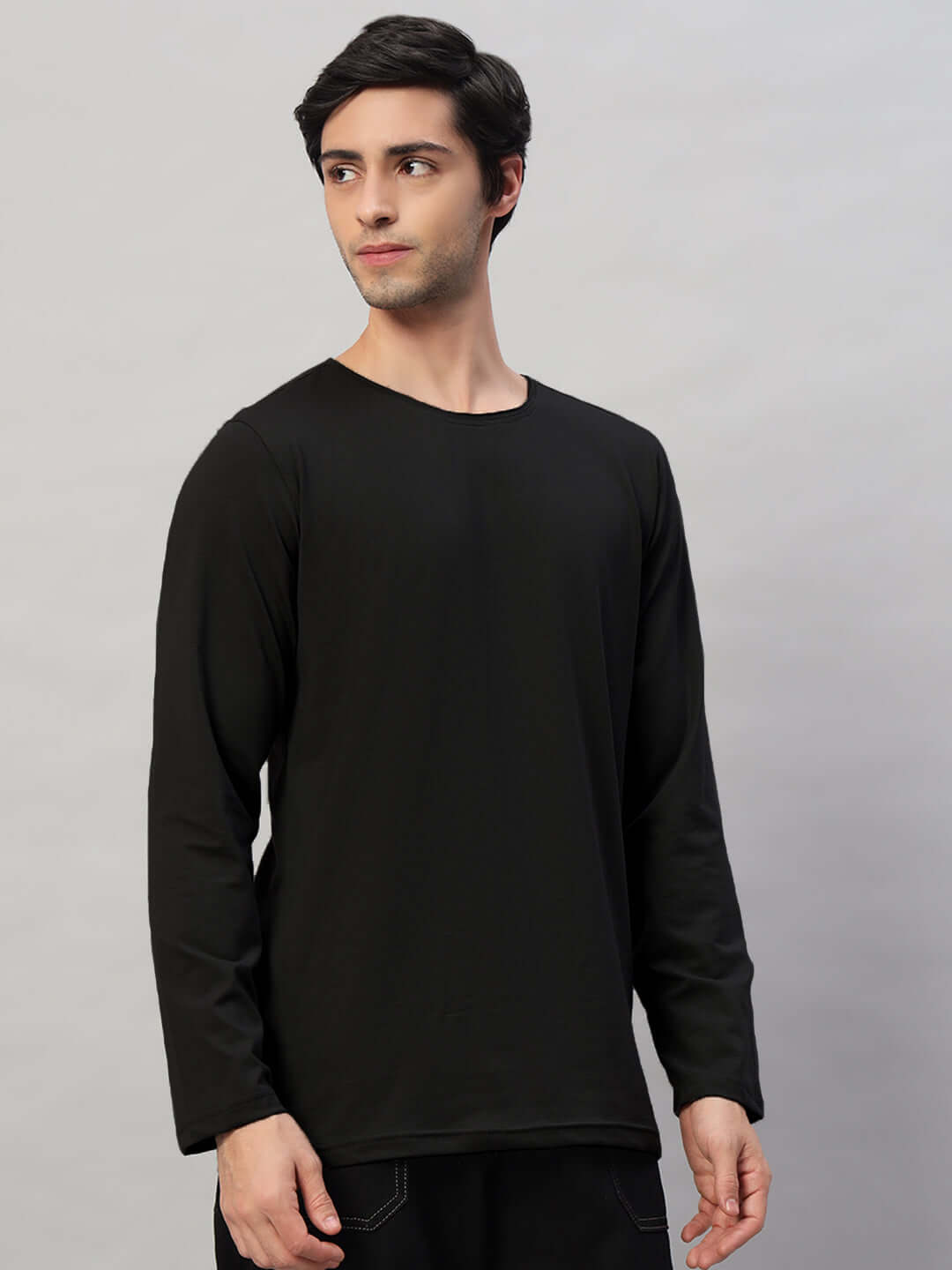Model wearing OMNI Slim Fit Black Sweatshirt made of premium 100% cotton fabric. Ideal for casual wear, crafted with care in India.