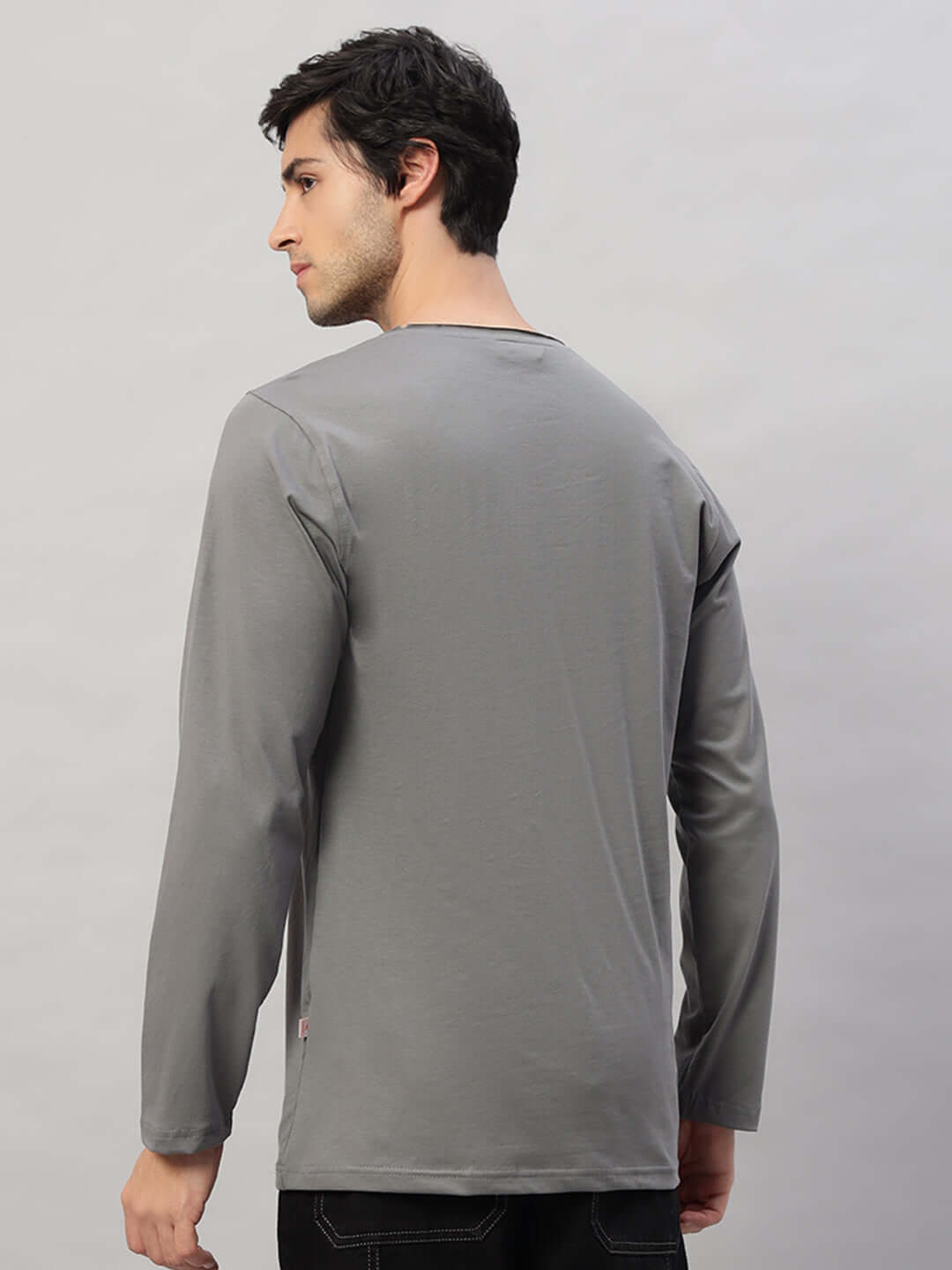 Back view of a model wearing a grey OMNI Slim Fit Sweatshirt made of 100% cotton, showcasing the stylish and comfortable design.