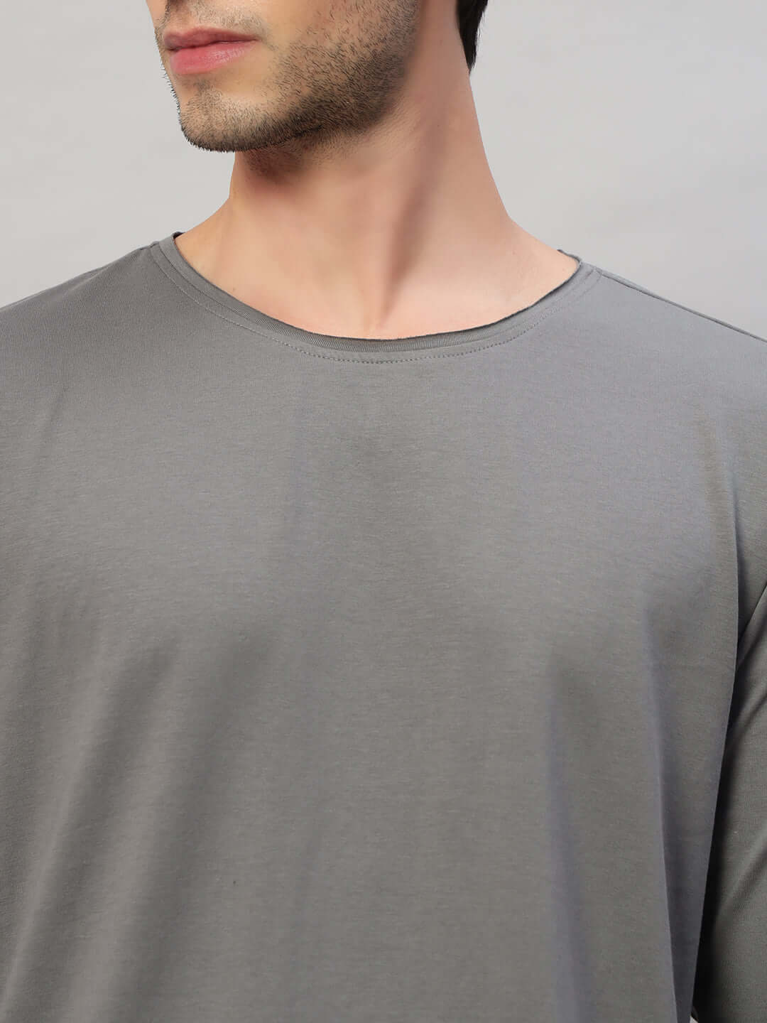 Model wearing OMNI slim fit grey sweatshirt made from premium cotton fabric.