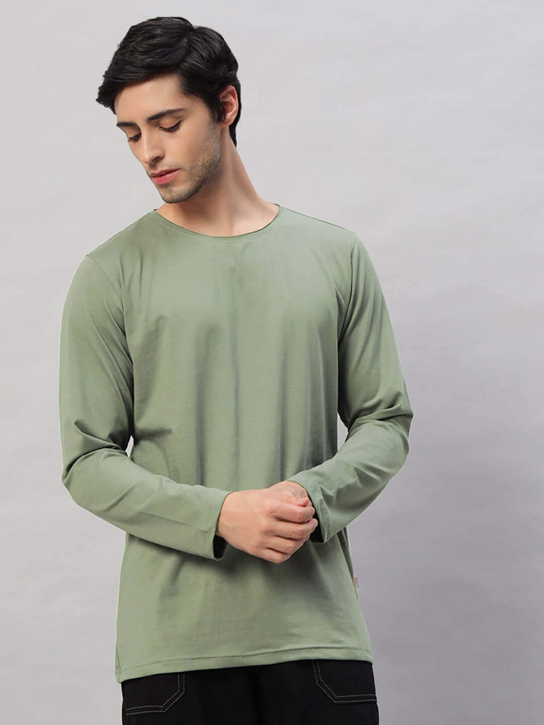 Model wearing OMNI Slim Fit Sage Green sweatshirt made from premium 100% cotton fabric, displaying a comfortable and stylish fit.
