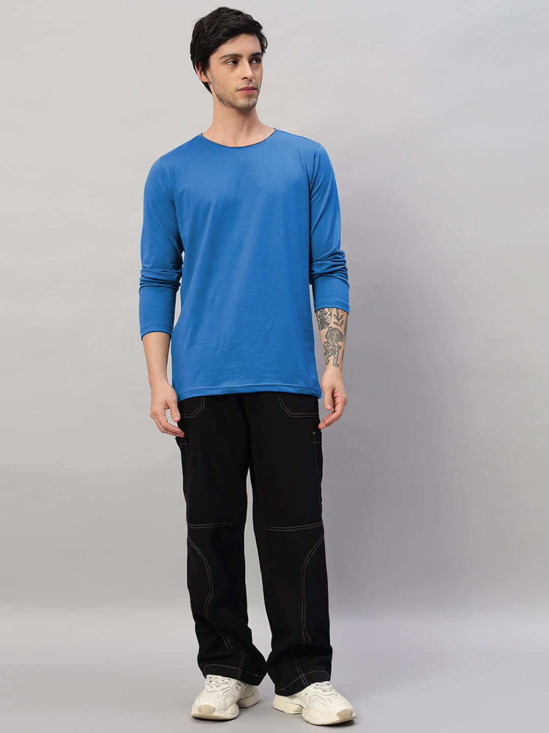 Model wearing Omni Slim Fit Sweatshirt in Royal Blue, premium 100% cotton, showcasing modern style and comfort.