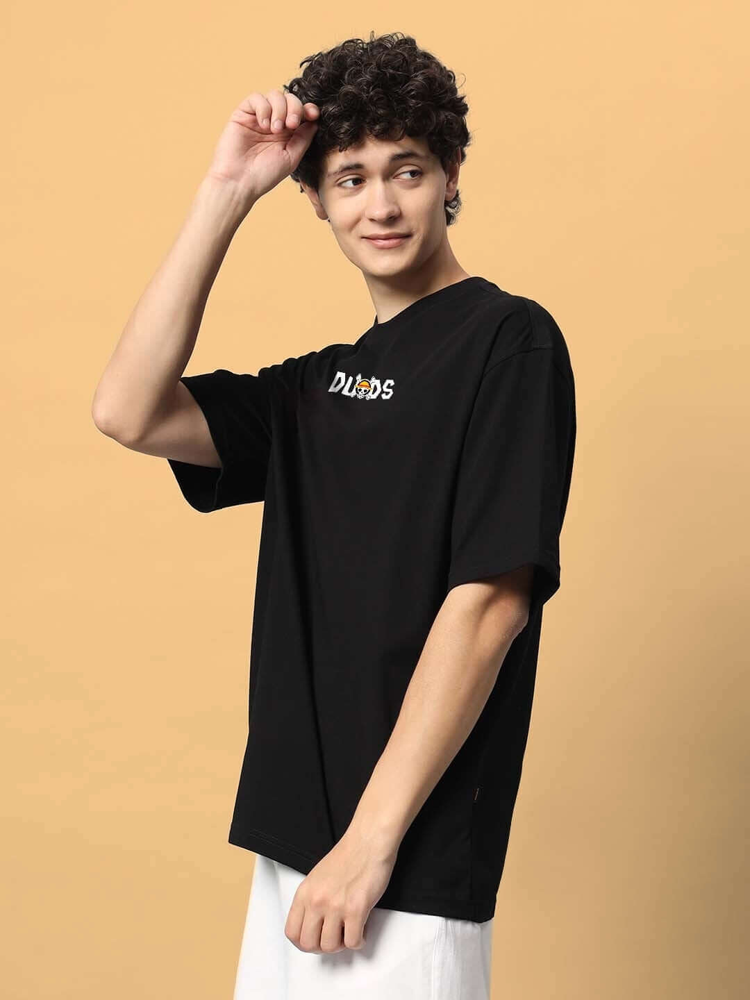 Model wearing black oversized ONE PIECE T-shirt by DUDS, customizable size option available for prepaid orders, handmade with care.