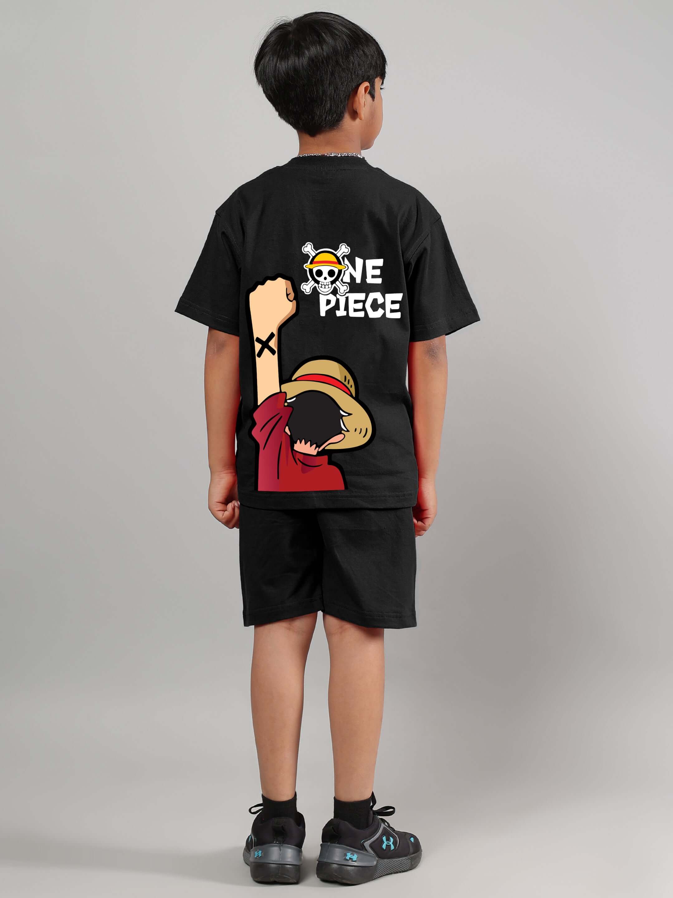 Child wearing black One Piece summer co-ord set featuring anime character design, perfect for boys and girls with customizable fit option.
